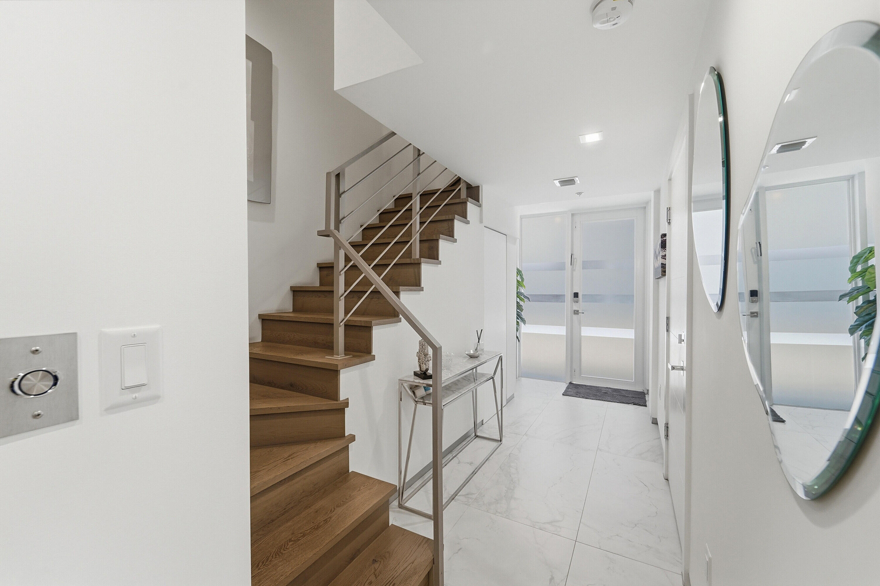 Don't Miss Out on this Stunning TURN KEY Victoria Park Corner Townhouse with Upgrades Galore! 3 bed, 3 bath luxury living with elevator, oversized primary suite, gorgeous en-suite spa bath and walk-in closet, two car garage, multiple balconies throughout, rooftop terrace with hot tub, smart technology ready. Modern hurricane impact rated windows and doors. PLUS-Premier Location! This property directly borders Holiday Park and Offers Endless Park Perks, Just Steps Away: enjoy immediate backyard playground, playing fields, exercise paths, easy pet walking plus dog park facility. Walk to outdoor summer concerts, indoor ice rink and Panther practice facilities, pickleball and tennis courts  PLUS a constant calendar of cultural and music events at the Parker Playhouse and War Memorial Auditorium & MORE. Las Olas Blvd for work or play just minutes to the South, Fort Lauderdale's sandy beaches just minutes to the East, I-95 access just minutes to the West. Daily conveniences abound.  This LUXURY contemporary gem has UPGRADES GALORE - far above and beyond builder offerings! Upgraded 2'x4' porcelain floor tile throughout, upgraded wood floor in stairways and 3rd floor primary suite. Upgraded recessed lighting throughout. Upgraded kitchen: beautiful custom premium cabinetry color and complete custom cabinetry storage solutions, including pantry pullouts and double layer drawer inserts. Kitchen also enhanced with upgraded Bosch stainless steel appliance package, including cooktop vent hood. Upgraded beveled glass subway tile backsplash. Designer touches throughout including drapery, glass pendant lights, remote controlled window treatments. Luxurious primary bath is upgraded with custom textural tile accent wall. Custom closet and storage solutions throughout, including: built in storage cabinetry in garage, customized bedroom closets, custom entry way storage closet. Enjoy the added square footage and vistas on the generous 4th floor sundeck, compete with hot tub.  Grab this opportunity to experience modern luxury yet low-maintenance living, with walkability and skyline views in the heart of Victoria Park.  THIS UNIT IS MOVE IN READY -- JUST BRING YOUR TOOTHBRUSH!     *Excluded from the sale are the TV and wall mounted custom media center in the living area as well as Primary Suite items: King Bed Frame and Headboard, End Tables and Bedside Pendant Lights. These items will not convey*   Being sold unfurnished. Furnishings are negotiable.   All information & measurements are approximate and deemed accurate and are subject to errors, omissions and changes without prior notice. It is the responsibility of Buyers and their agents to independently verify all information.
