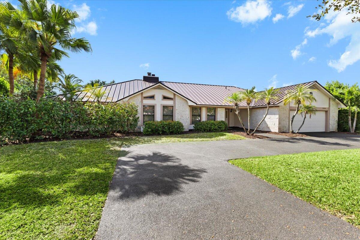 5BR/4BA gigantic home in Coral Springs Country Club.  2025 metal roof, PGT impact windows, 2026 appliances, upgraded plumbing/electrical - maximum insurance discounts, safety, comfort and energy efficiency from Day 1.  No HOA.  No Cast Iron pipes.  Private fenced in yard on enormous corner lot.  Large pool, covered patio and deck under screen enclosure.  Oversized garage with impact door.  Removable storm panels.  Direct access to Country Club and golf course - membership not required.    Hybrid electric water heater, dual zoned high seer A/Cs, vaulted ceilings, 2 new washer/dryers and updated kitchen/baths.  Primary suite with private vanity, 2 sinks, washer/dryer, 2 closets, toilet room, Roman tub and huge shower.   A+ rated schools, parks, gymnasium and shopping within walking distance.