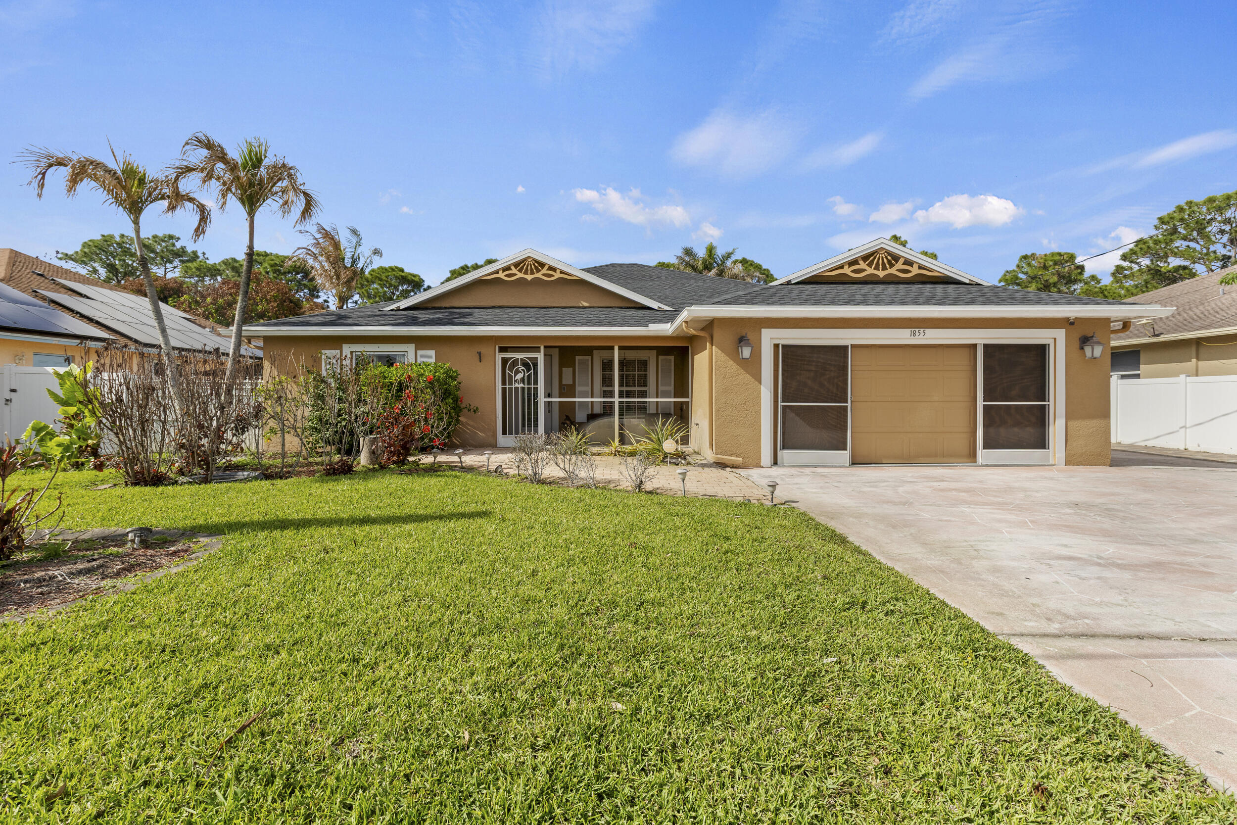 Spacious 4BR/3BA home offering over 2,100 sq ft of living space with a desirable split floor plan. Features include a large family room, upgraded kitchen with granite countertops, upgraded bathrooms, and ample cabinet space. Enjoy outdoor living with a screened lanai and fully fenced backyard with above ground pool, perfect for entertaining. Conveniently located near schools, shopping, and major roadways in Port St. Lucie.