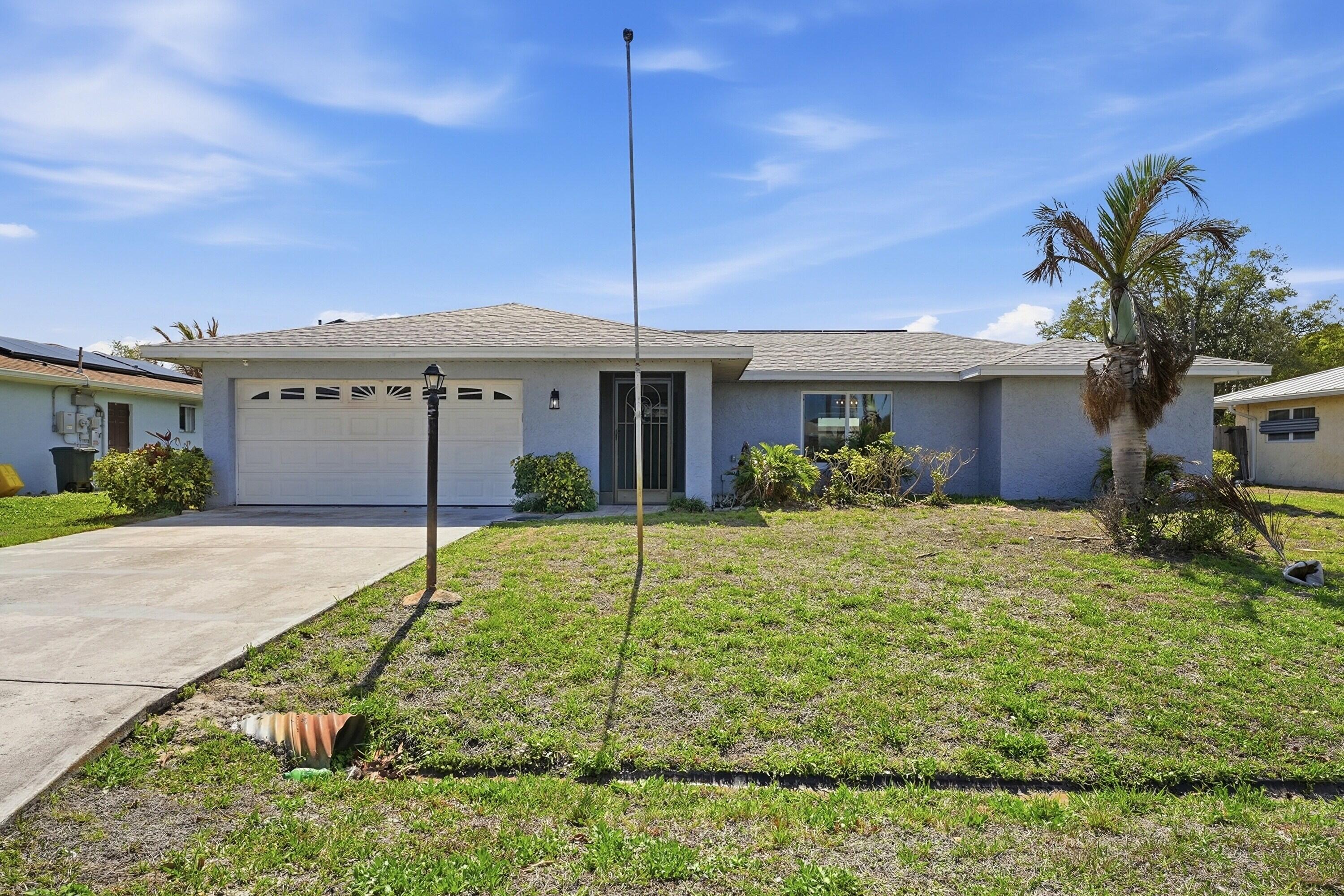 This CBS Pool Home has it All ! Centrally located with easy access to Shopping, Hospital, !/2 block from SE Crowberry Drive and North Fork of the St. Lucie River. Spacious Interior features Large Master Suite, and Huge Family Room Plus a Completely Renovated Kitchen. New Architectural Shingle Roof was Installed in July 2022. Solar powered Electric and New A/C and Hot Water Heater installed July 2022 Too ! Exterior boasts a Large Screened in Pool that was Refinished Plus New Tile in 2024. Oversized Porch Area is Perfect for Entertaining.  WOW New Hurricane Impact Windows Installed in 2025.  Who Could ask for anything more ? Priced to Sell Quickly !  House will be available for showings very soon ! Loan on Solar equipment is assumable