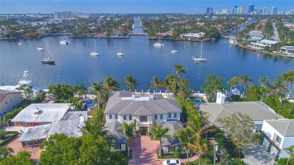 TIMELESS TRANSITIONAL home overlooking Lake Sylvan.  A well designed floor plan with amazing views of water and city skyline from almost every room. Walls of glass open this residence from the family room, dining room, office and more!  All bedrooms are huge with en-suite baths, custom built-ins, closets, and more.  Fabulous wine room, elevator, and 4 car garage complete this wonderful home.  Custom finishes done with sophistication offering simply the best for any buyer. Furniture can be negotiable.