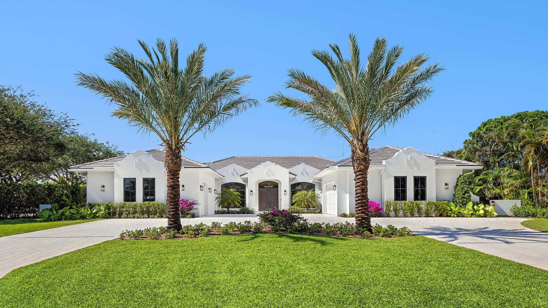 Brand-new custom estate in the exclusive enclave of Place Au Soleil, offering an exceptional blend of architectural presence, modern luxury, and effortless livability. Set on an oversized half-acre corner lot just minutes from Atlantic Avenue, this British West Indies-inspired single-story residence showcases soaring wood-paneled ceilings, bespoke custom cabinetry throughout, and beautifully curated designer finishes that create a warm yet sophisticated atmosphere. Expansive interiors seamlessly transition to resort-style outdoor living and entertaining spaces, delivering the ultimate South Florida lifestyle. A true custom property featuring smart home technology, full-house generator, and every detail thoughtfully designed for elevated everyday living. KEY FEATURES & HIGHLIGHTS  Property & Layout  • 5 Bedrooms | 5 Bathrooms • 4,872 Sq Ft Under Air | 6,675 Total Sq Ft  • Rare single-level living with seamless flow  • Oversized 21,851 Sq Ft lot (0.50+ acres)  • Full 3-car garage + expansive motor court (fits ~10 vehicles)  • Immediate occupancy available    Interior Design & Living  • Soaring ceilings with dramatic great room and floor-to-ceiling glass  • Coffered ceiling detail and statement fireplace  • Professionally curated interiors with timeless coastal palette  • Open-concept layout designed for entertaining and everyday ease  • Dedicated lounge space off the kitchen    Chef's Kitchen  • Sub-Zero, Wolf, and Fisher & Paykel appliance package  • Oversized 5' x 16' island • Hidden, oversized butler's pantry  • Gas conversion infrastructure already in place    Primary Suite Retreat  • Private sitting area  • Spa-level bathroom with soaking tub and multi-head shower  • In-suite dry sauna  • Dual custom walk-in closets (ready for buyer selection)  • Integrated bidet system    Outdoor Living  • Resort-style infinity-edge pool and spa  • Dual sun shelves with varying depths  • Expansive covered lanai with full summer kitchen and bar  • Outdoor fireplace and entertainment lounge  • Architecturally designed loggia prepped for retractable screens  • Lush, private half-acre setting    Smart Home & Systems  • Centralized smart home control (climate, lighting, audio)  • Pre-wired for full-house audio, security, and future expansion  • Pre-wired windows for motorized shades or smart glass  • Whole-house Generac generator  • Three-zone HVAC system  • Tankless water heaters  • Whole-home water filtration    Community & Location  • Private Intracoastal community with 24/7 police presence  • Golf cart-friendly neighborhood  • Very low HOA ($22/month)  • Minutes to Gulf Stream Golf Club and Atlantic Avenue     All images and visual materials associated with this property, including AI generated images, virtually staged photos, edited images, artist conceptual renderings, maps, site plans, floor plans, and other graphics, are provided solely for illustrative purposes. These representations may not accurately reflect current conditions and are subject to change without notice. No representations or warranties are made regarding the accuracy or completeness of these visual materials. Buyers should not rely solely on these materials and are responsible for independently verifying all property details.