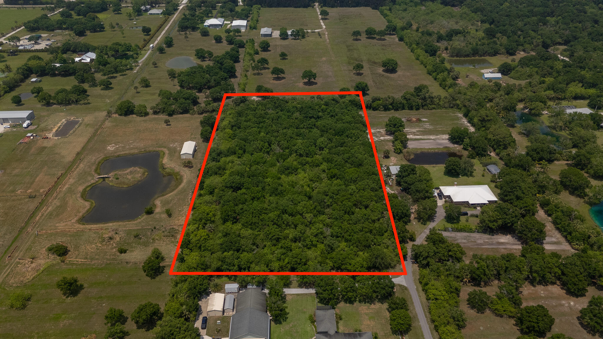 Let's Make a Deal/ Motivated Seller! Opportunity Awaits! 5.09 Acre Property Surrounded by Large Equestrian Estate Homes. Zoned A-1. Located Off of a Paved Road. Buyers to Bring in Utilities and Verify Building Requirements. Great Opportunity to Build in the Northwest Section of Vero Beach. Approximately 400 Ft X 500 Ft., Property Dimensions Approximate. Close To Everything in Vero.