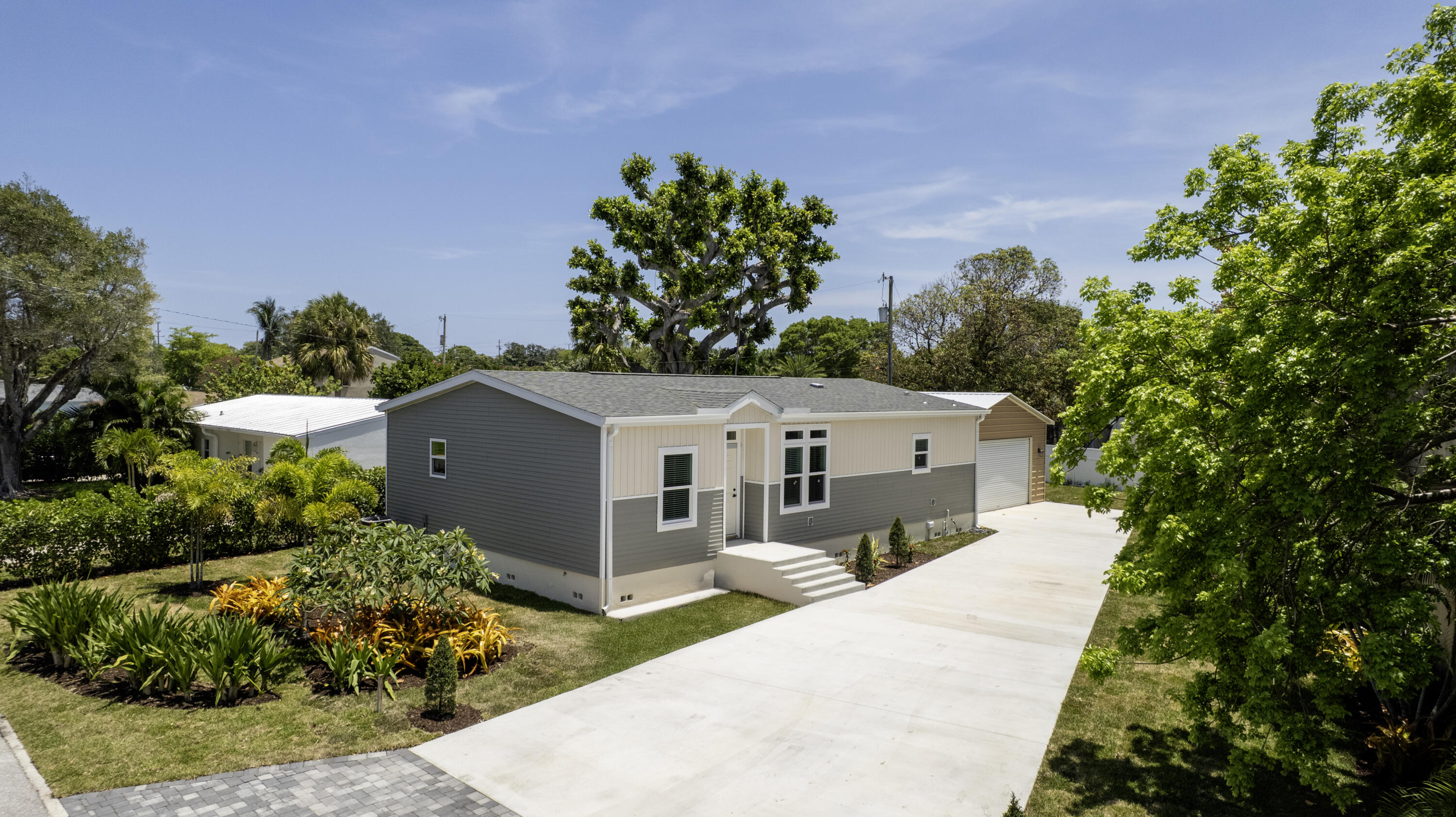 NEW CONSTRUCTION + PRICE IMPROVEMENT! Beautiful single family home in the heart of Lake Worth. Perfect for car enthusiasts! Don't miss this opportunity to own this beautifully designed home with 25'x23' 2 car garage with 10' ceilings and a 9' rolling commercial grade door. This home features impact windows/doors, insulated flooring and R42 in the ceiling help keep this home cooled easily! 9' ceilings throughout with designer light and ceiling fans in each room. Coveted split floor plan and large dedicated laundry/pantry/storage room. Property is built upon a 5-foot concrete block foundation and rated for over 140mph winds - creating a worry free home come hurricane season. Just minutes from the beach, shopping, dining, highways and downtown Lake Worth. Non HOA Community!