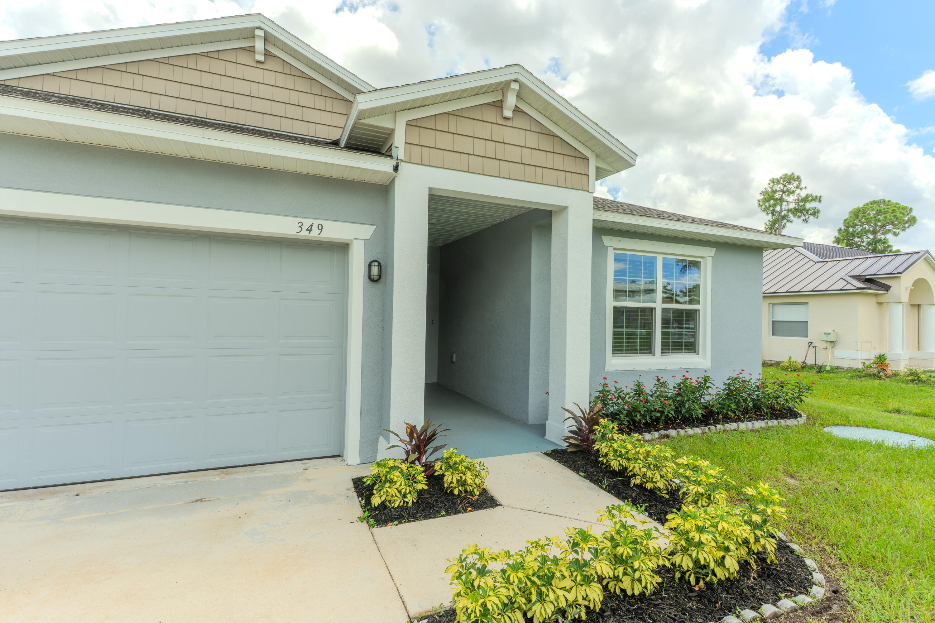 Welcome to 349 NW Aurora Street in the heart of Port St. Lucie! Built in 2022, this beautifully maintained home shows like new and offers the perfect blend of modern style and everyday comfort. Featuring tasteful upgrades throughout, the open-concept floor plan is ideal for both entertaining and daily living. The spacious kitchen flows seamlessly into the living and dining areas, while the well-appointed bedrooms provide comfort and privacy. Conveniently located just minutes from St. Lucie West, you'll enjoy easy access to shopping, dining, schools, parks, medical facilities, and I-95, making commuting a breeze. Whether you're a first-time homebuyer, growing family, or looking to downsize without sacrificing quality, this move-in-ready home is one you won't want to miss!