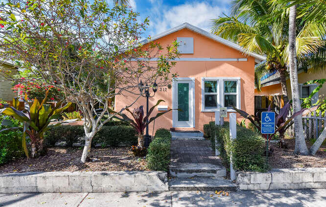 Charming cottage style home in the heart of Lake Worth Beach ! Just minutes from the beach and vibrant downtown, this adorable retreat captures the area's signature artsy laid back vibe, perfect as full time residence , vacation home, or investment.   Situated on a rare , buildable double lot, the property offers incredible potential to expand or create your own private oasis, Recent updates include 2023 metal roof with double insulation and airspace. Along with updated electrical panel and service line for added peace of mind.  The property also features water and electrical hook up for an RV, providing flexibility for future use or additional income potential.  A unique opportunity with room to grow. Priced to sell and ready for its next owner.