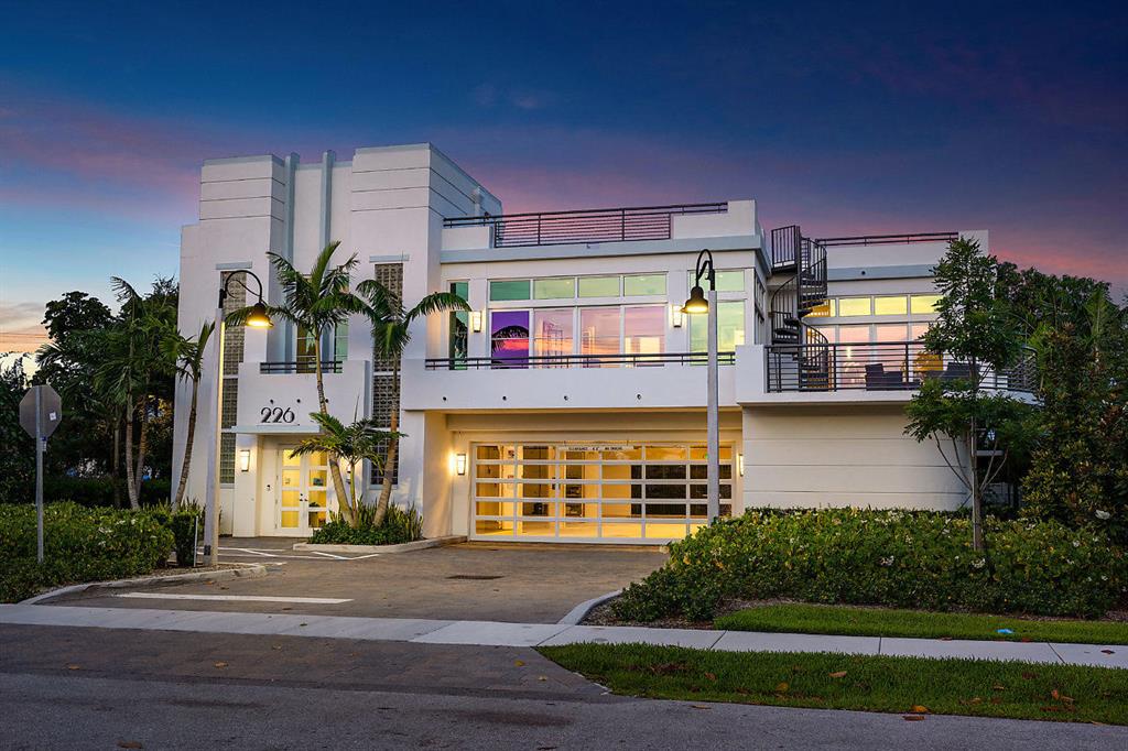 Make this your 10,000 sq ft home!
Turn it into your own private clubhouse residence.  Park your car collection in your own 12 car garage. You can add a roof top putting green and pool and enjoy your outdoor kitchen. This Contemporary Art Deco building can be your home, your office or Both! Features high ceilings, floor to ceiling glass, roof top terrace where you can add your own putting green, a swimming pool and outdoor kitchen . It boasts the ability for car collectors to park up to 12 cars in a protected private garage beneath the residence. This property has it all, and only a short walk to restaurants and beach. All Impact Glass, Commercial Elevator and 130 KW Generator. In these days of working at home, no other property has more flexability- Overall 10,248 sq ft of covered areas including garage and 6334 excluding garage-Also includes 
Large Commercial Elevator
Oversized 130 KW Generator
all Impact Glass
Natural Gas Generator and Appliances
Private Electric charging Stations
Security Cameras Throughout
14 Overall Parking Spaces
Private Terrace off Kitchen w Outdoor Spiral Staircase to roof deck
Private Parking Garage
Private Rooftop Deck built for Outdoor Lap pool and kitchen
3 Phase Electric 
Post tension construction used to create large Open Space w/ few interior columns and High Ceilings

Current Office Layout:
8 Private Office Rooms
Reception Area
Private Executive Office w/ Steam Shower and Full Bath and wrap around floor to ceiling glass
7 Bathrooms 
1 BR apartment w/ 2 Full Baths, Large Open Kitchen, 12 ft Ceilings, Wrap around Floor to Ceiling Glass
Large Free Standing Signage with name on Busy Highly visible corner of George Bush Blvd
Walk to work by opening the door to the office
Walk to Restaurant, bakeries, coffee shops and the Beach!
True Live-Work-PLAY!