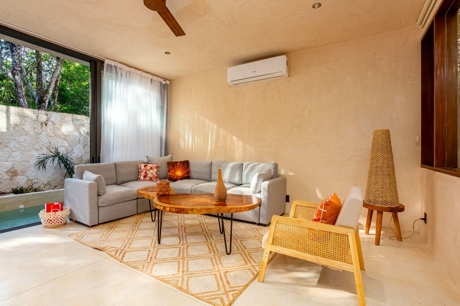 Beautiful 3-bedroom, 3-bathroom villa located in the gated AMARI Uptown community in Tulum. Delivered and ready for immediate use. This three-level home offers a functional layout with seamless indoor-outdoor living. The ground floor features an open-concept kitchen, dining, and living area that connects directly to a private garden and pool. A flexible enclosed space on this level can be used as a third bedroom, office, or additional guest area, along with a full bathroom. The second floor includes two bedrooms, including the primary suite with en-suite bath and terrace access, providing separation and privacy from the main living areas. The third level features a rooftop terrace with open lounge space, suitable for outdoor use and entertaining. Finishes include chukum walls, polished con
