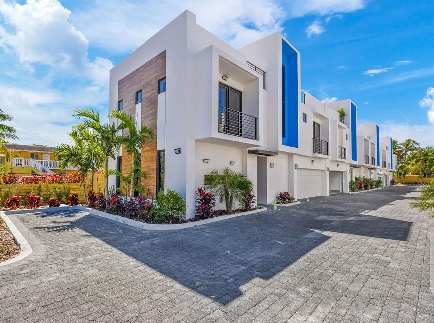 BRIGHT, BEAUTIFUL, CONTEMPORARY NEW CONSTRUCTION TOWNHOUSE 3 BEDROOMS AND 2.5 BATHS + DEN SPACIOUS AND OPEN 3,349 SqFt LAYOUT FOR STUNNING LUXURIOUS LIVING. ESCAPE TO THE ROOFTOP TERRACE OR GORGEOUS OPEN KITCHEN DESIGNED WITH QUARTZ COUNTERTOPS AND LARGE WATERFALL ISLAND THAT HAS NEVER BEEN MORE ENJOYABLE. COMBINE THE BEST OF BEAUTY AND CONVENIENCE IN A HOME YOU'LL SIMPLY LOVE LIVING IN. PORCELAIN FLOORS, SPACIOUS MASTER SUITE WITH 2 WALKIN CLOSETS, BALCONIES, PRIVATE FENCED BACKYARD, ROOFTOP 1,000 SQFT +/- WITH SUMMER KITCHEN HOOK-UPS, 2 CAR GARAGE, HURRICANE IMPACT WINDOWS AND DOORS. MOST VIBRANT NEIGHBORHOOD WALKING DISTANCE TO RESTAURANTS, SHOPPING AND ALL THE ENTERTAINMENT IN WILTON MANORS, MIN DRIVE TO THE BEACH AND DOWNTOWN FORT LAUDERDALE. ROOFTOP KITCHEN & SPA OPTIONAL ADD ONS.