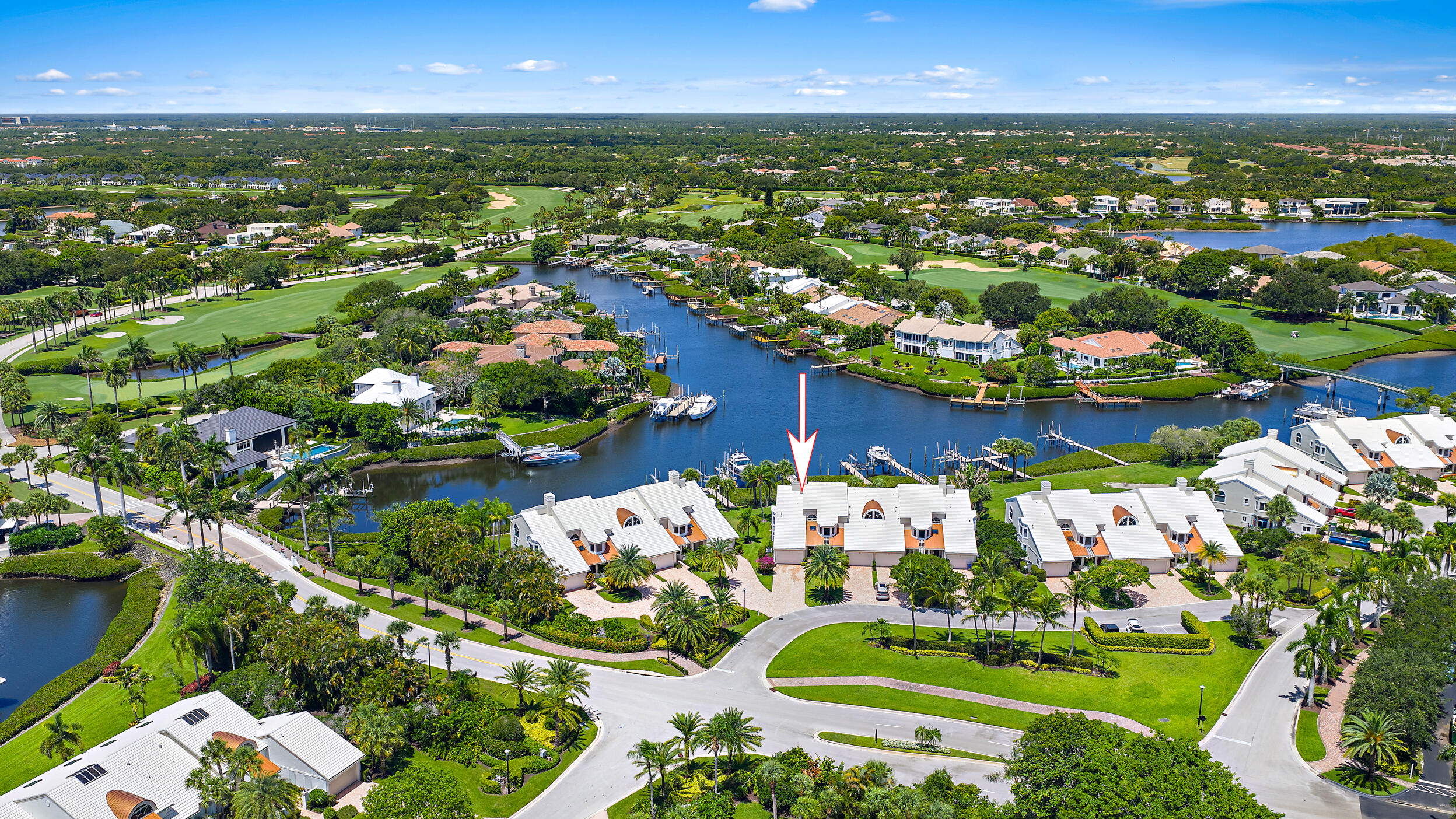 Beautifully updated harbor home in the prestigious Admirals Cove, offering an exceptional waterfront lifestyle just steps from the Club. Ideally positioned with long water views, this residence features a private dock with a 40,000-pound boat lift, providing an ideal setup for boating enthusiasts.  Inside, the home has been thoughtfully renovated with a clean, contemporary design featuring a stunning custom kitchen with high-end appliances, spacious open living areas, beautifully updated baths, and an elegant entertaining bar complete with dual wine refrigerators and illuminated floating display shelves—perfect for hosting family and friends. Large walls of glass fill the home with natural light while framing the picturesque waterfront views throughout the main living spaces. Whether you're heading out on the boat, entertaining guests, or simply enjoying the peaceful water views from the comfort of your home, this residence offers an effortless waterfront lifestyle in one of Admirals Cove's most desirable locations.  Located just a short walk or golf cart ride from the Admirals Cove Club, you'll enjoy convenient access to world-class golf, tennis, pickleball, fitness, marina, fine dining, and every amenity that makes Admirals Cove one of South Florida's premier private communities.