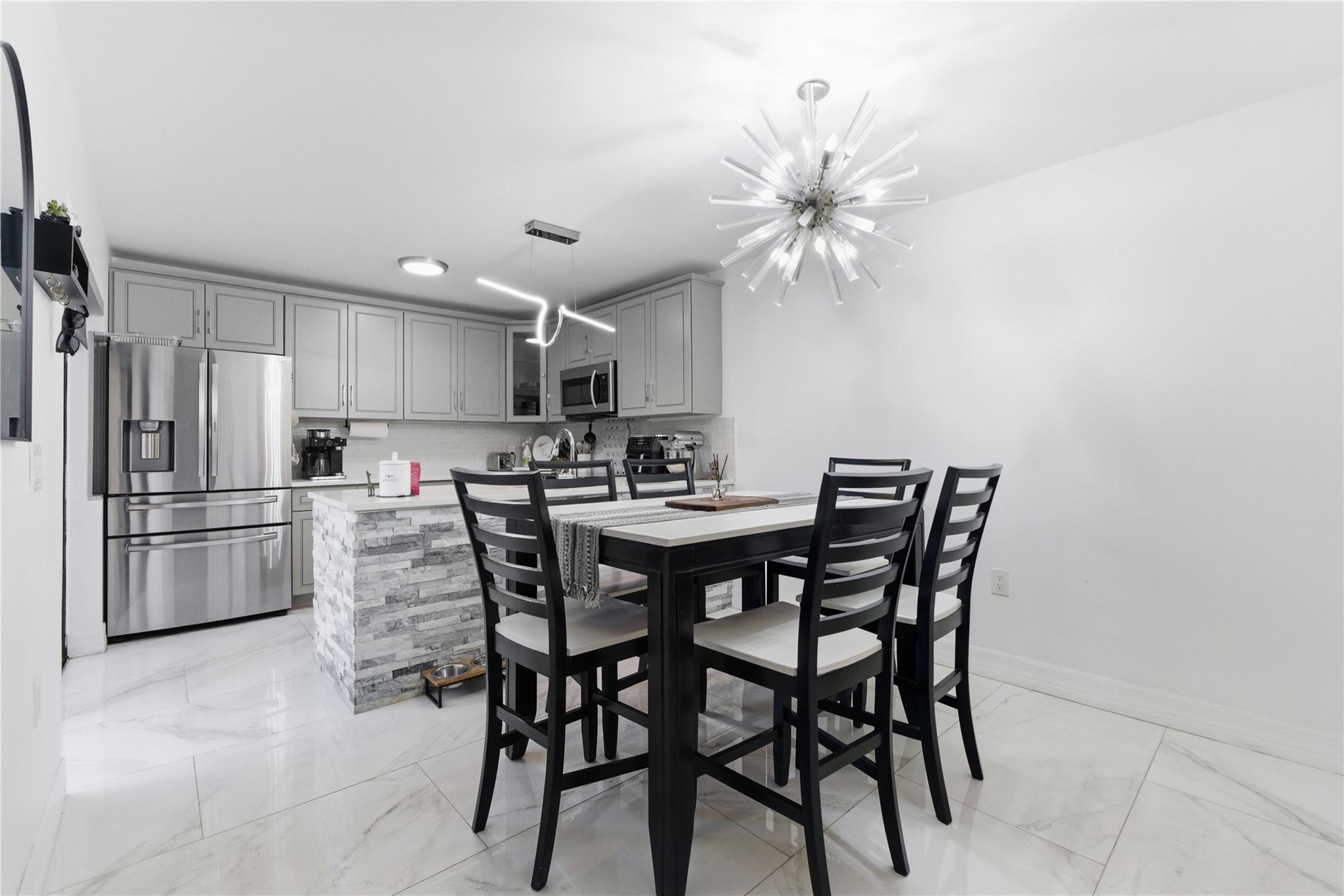 Welcome to this beautifully renovated 2-bedroom, 2.5-bathroom townhome just minutes from downtown West Palm Beach. Thoughtfully updated from top to bottom, this move-in-ready home features a bright open-concept layout, modern finishes, and stylish upgrades throughout.The spacious kitchen boasts updated cabinetry, sleek countertops, and stainless steel appliances. The primary suite offers a private en-suite bathroom and generous closet space, creating a comfortable retreat. The second bedroom is spacious and versatile, with access to a full bathroom nearby.Enjoy the convenience of being close to shopping, dining, and nightlife, all while tucked into a quiet, well-maintained community.