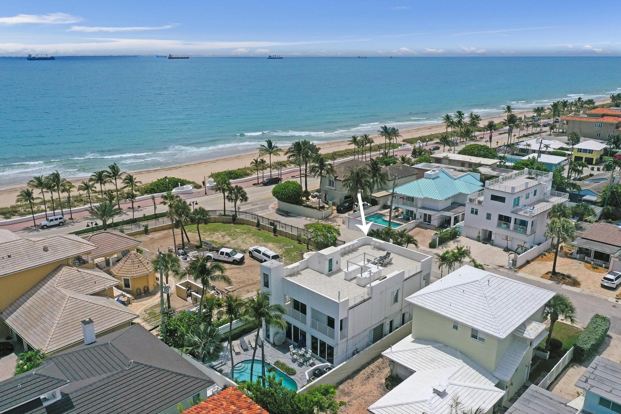Just one house from the ocean, this fully gated luxury residence offers spectacular ocean views from multiple levels. Featuring 4 bedrooms, 3 baths, a private elevator, whole-house generator, impact windows and doors, surround sound, and a gourmet kitchen with stainless steel appliances, marble countertops, and a large breakfast bar. The stunning primary suite showcases breathtaking ocean views and a private balcony, creating the perfect coastal retreat. Every second-floor bedroom enjoys beautiful ocean views and outdoor access. Designed for entertaining, enjoy the heated pool, spa, summer kitchen, and an expansive 1,800+ sq. ft. rooftop deck with panoramic ocean views in every direction, complete with a BBQ grill, cooktop, and sink. Minutes from Las Olas, fine dining, and shopping.