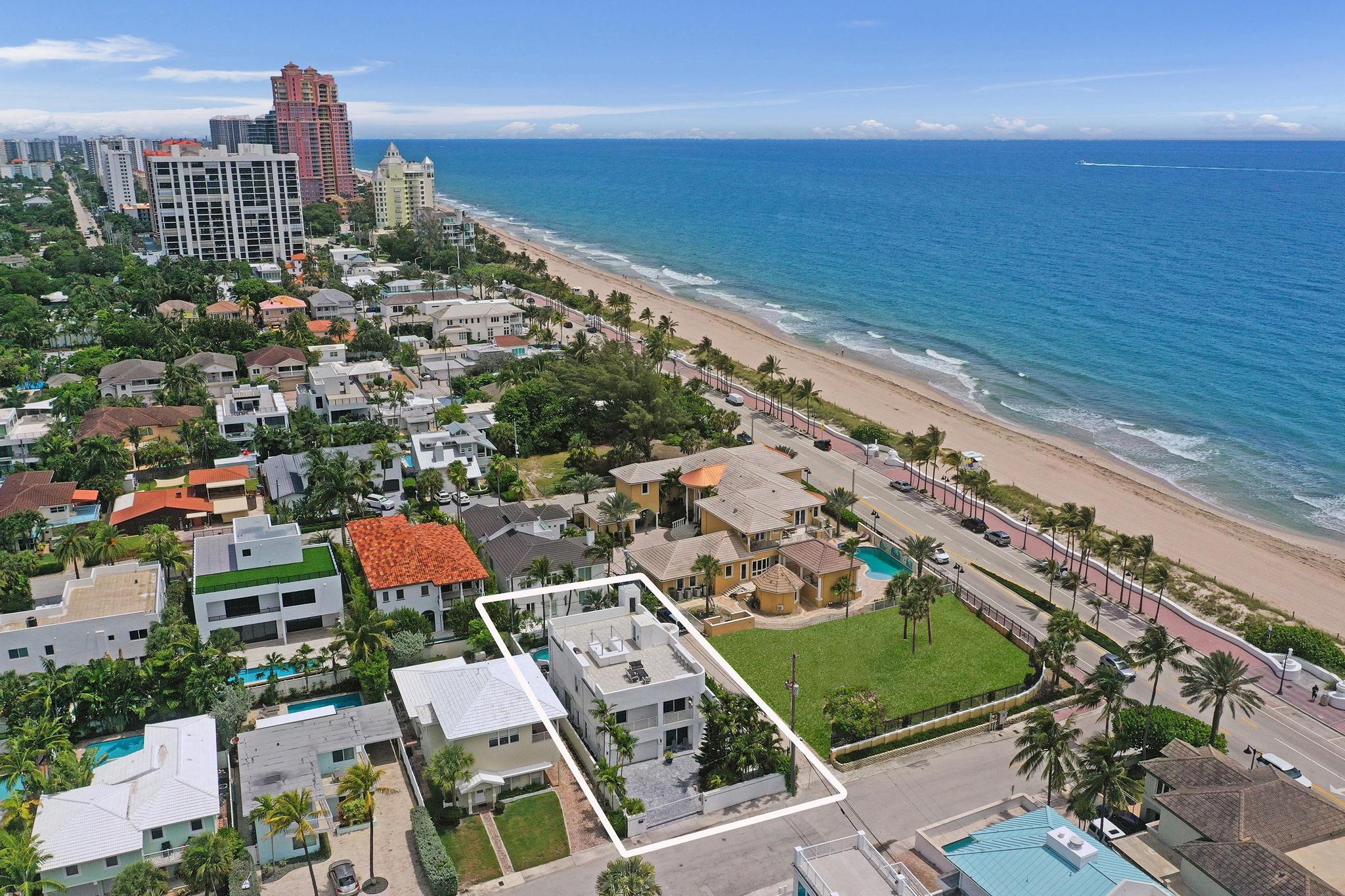Just one house from the ocean, this fully gated luxury residence offers spectacular ocean views from multiple levels. Featuring 4 bedrooms, 3 baths, a private elevator, whole-house generator, impact windows and doors, surround sound, and a gourmet kitchen with stainless steel appliances, marble countertops, and a large breakfast bar. The stunning primary suite showcases breathtaking ocean views and a private balcony, creating the perfect coastal retreat. Every second-floor bedroom enjoys beautiful ocean views and outdoor access. Designed for entertaining, enjoy the heated pool, spa, summer kitchen, and an expansive 1,800+ sq. ft. rooftop deck with panoramic ocean views in every direction, complete with a BBQ grill, cooktop, and sink. Minutes from Las Olas, fine dining, and shopping.