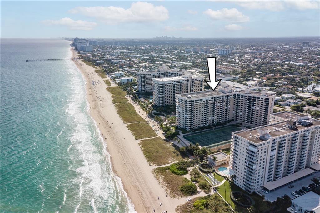 Fantastic opportunity to own your own slice of beachfront living! 2/2 plus bonus rom / office / den facing south east with direct ocean views! Both bedrooms & living room face the ocean. Watch the sunrise from your balcony with views of the pool. Live in a resort with amenities on 14 acres of prime beachfront! Walkways to the beach, Heated pool, tennis courts, BBQs, open-air kitchen, gym, pet park, cabanas, bike storage, billiard room, large party room! 24 hour security, 2 pets allowed 20lbs or less, garage parking & rent from day 1. Amazing location - Publix, restaurants, shops across the street & a short walk to quaint Lauderdale by the Sea with numerous restaurants, shops & fishing pier. Close to downtown Ft. Lauderdale & airport, Lauderdale by the Sea. Coral reef just off shore!