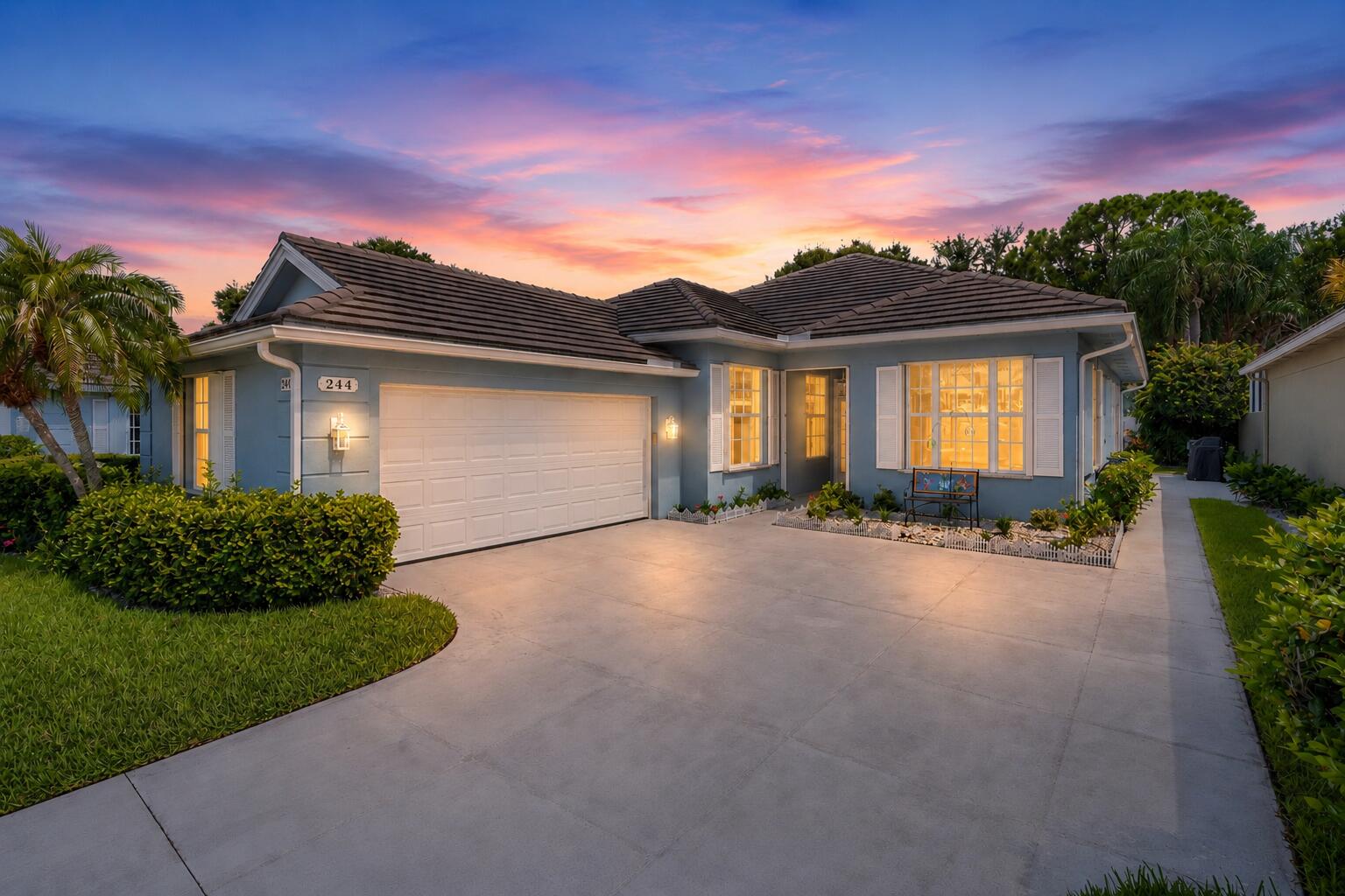 Welcome home to this meticulously maintained, newly painted 3-bedroom, 2.5-bath residence tucked away on a quiet cul-de-sac in a lush, beautifully landscaped community. This hidden gem offers the perfect blend of privacy and convenience, just minutes from shopping, dining, golf, beaches, medical facilities, major highways, Palm Beach International Airport, and the New York Mets Spring Training facility.  Light, bright, and move-in ready, this spacious split-bedroom floor plan features soaring ceilings and an open layout designed for comfortable everyday living and effortless entertaining. The beautifully updated kitchen is the heart of the home, showcasing white cabinetry with pull-out shelves, quartz countertops, stainless steel appliances, a cooktop, a wall oven with convection and air fryer features, stunning glass display cabinet, and a center island perfect for gathering.  The spacious primary suite offers two large closets and an ensuite bath with separate his-and-hers vanities connected by a shared shower, plus a relaxing garden tub—the perfect place to unwind and let the stress of the day melt away. Two additional bedrooms provide flexible space for family, guests, or a home office.  Step outside to your own private, fenced backyard oasis complete with lush tropical landscaping and an expansive covered, screened lanai—ideal for year-round entertaining, outdoor dining, or simply enjoying Florida's beautiful weather. Major updates include a plumbing repipe (2020), hurricane-rated garage door (2023), updated flooring throughout most of the home, and a new water heater (2025).  Low HOA dues include lawn care, basic cable, internet, two community pools, tennis and pickleball courts, and more.   Don't miss your opportunity to own this exceptional hidden gem—schedule your private showing today!