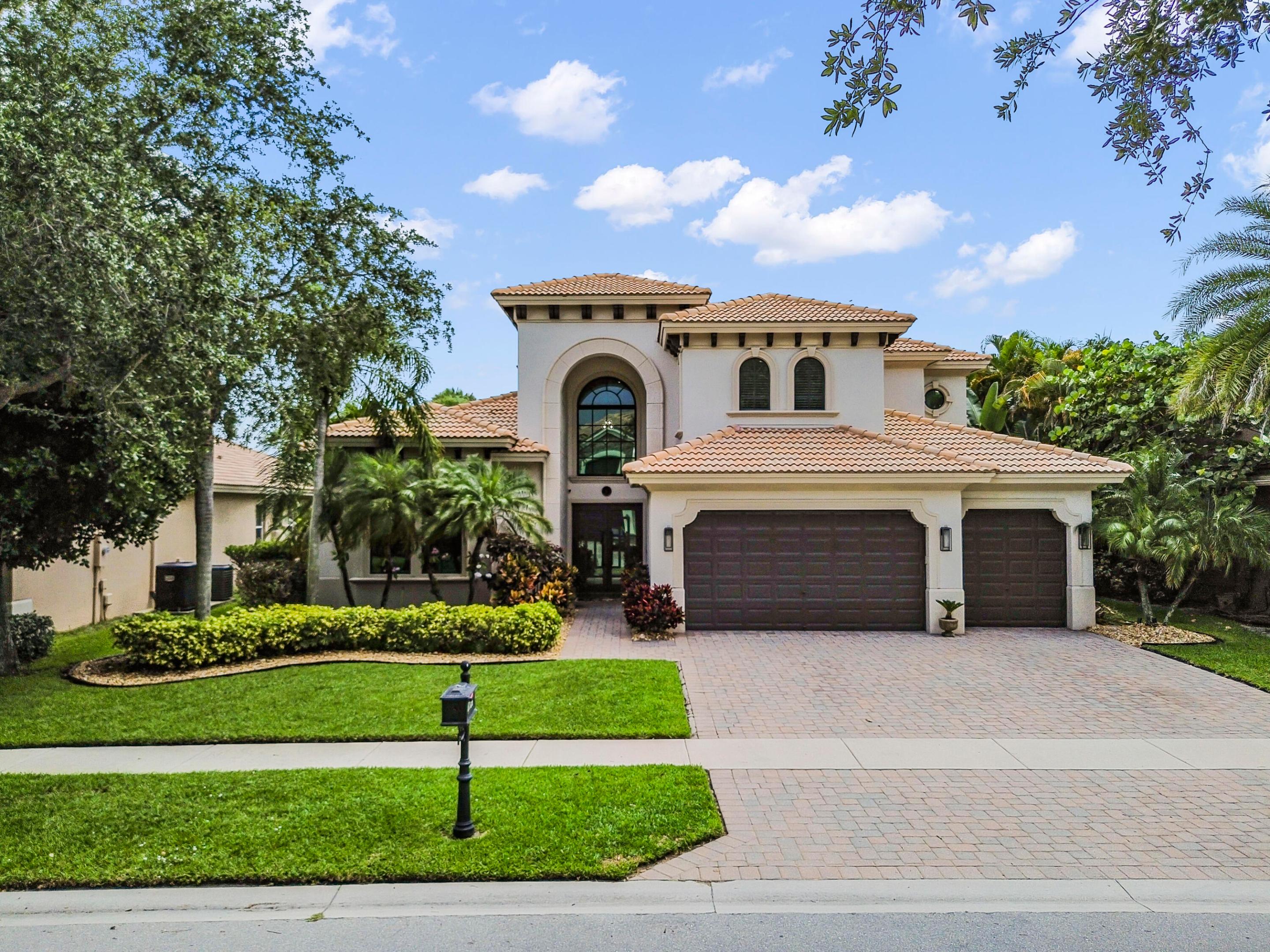 Welcome to this exceptional Toll Brothers 4-bedroom, 4.5-bathroom, plus office with a 3-car garage waterfront residence offering luxurious upgrades, modern finishes, and a beautifully designed outdoor retreat located within the highly sought-after gated community of Wellington View.  This spacious two-story home features impact glass/hurricane windows and doors with E-glass and tint (2023), providing both peace of mind and energy efficiency. A grand two-story foyer welcomes you into elegant formal living and dining areas accented by architectural details and soaring ceilings. The gourmet kitchen showcases stunning Taj Mahal quartzite countertops (2020) and flows seamlessly into the breakfast area and expansive family room, creating the perfect setting for everyday living and entertaining.  The living area is enhanced by a custom-built-in entertainment system with a travertine backsplash (2020). The luxurious first floor primary suite offers a private retreat with a beautifully remodeled primary bathroom (2020) and an upgraded custom closet (2023). Throughout the home, all bedrooms, the staircase, and the loft area feature Dutch Oak wood laminate flooring (2020), while all bedrooms and bathrooms have been freshly repainted between 2020 and 2025. Additional interior upgrades include updated lighting throughout the home, a new dishwasher (2022), three AC unit replacements (2021 and 2023), and a new water softener and reverse osmosis system (2025). Step outside to the private waterfront oasis where the backyard features maintenance-free landscaping, and artificial grass. Nature lovers will appreciate the exceptional setting. The estuary located behind the home serves as a protected bird preserve, attracting beautiful wildlife including Sandhill Cranes, Roseate Spoonbills, White Cranes, Purple Gallinules, and numerous species of ducks—creating a peaceful and picturesque environment right outside your door.  The resort-style pool has been extensively updated with PebbleTec resurfacing (2021), a saltwater conversion (2023), and a new pool pump with a wireless automation system (2025). Additional exterior enhancements include a freshly painted exterior (2023) and updated exterior lighting with automated Govee and Edison lighting systems, perfect for evening ambiance and entertaining.  Tucked away in unincorporated Palm Beach County, it offers the highly desired Wellington lifestyle with the benefit of lower property taxes, yet just minutes away from top equestrian venues, shopping, dining, entertainment, turnpike and the airport. Combining 4 bedrooms, 4.5 bathrooms plus office, 3-car garage, waterfront views, premium upgrades, and exceptional outdoor living, this move-in-ready home delivers the perfect blend of luxury, comfort, and modern conveniences.