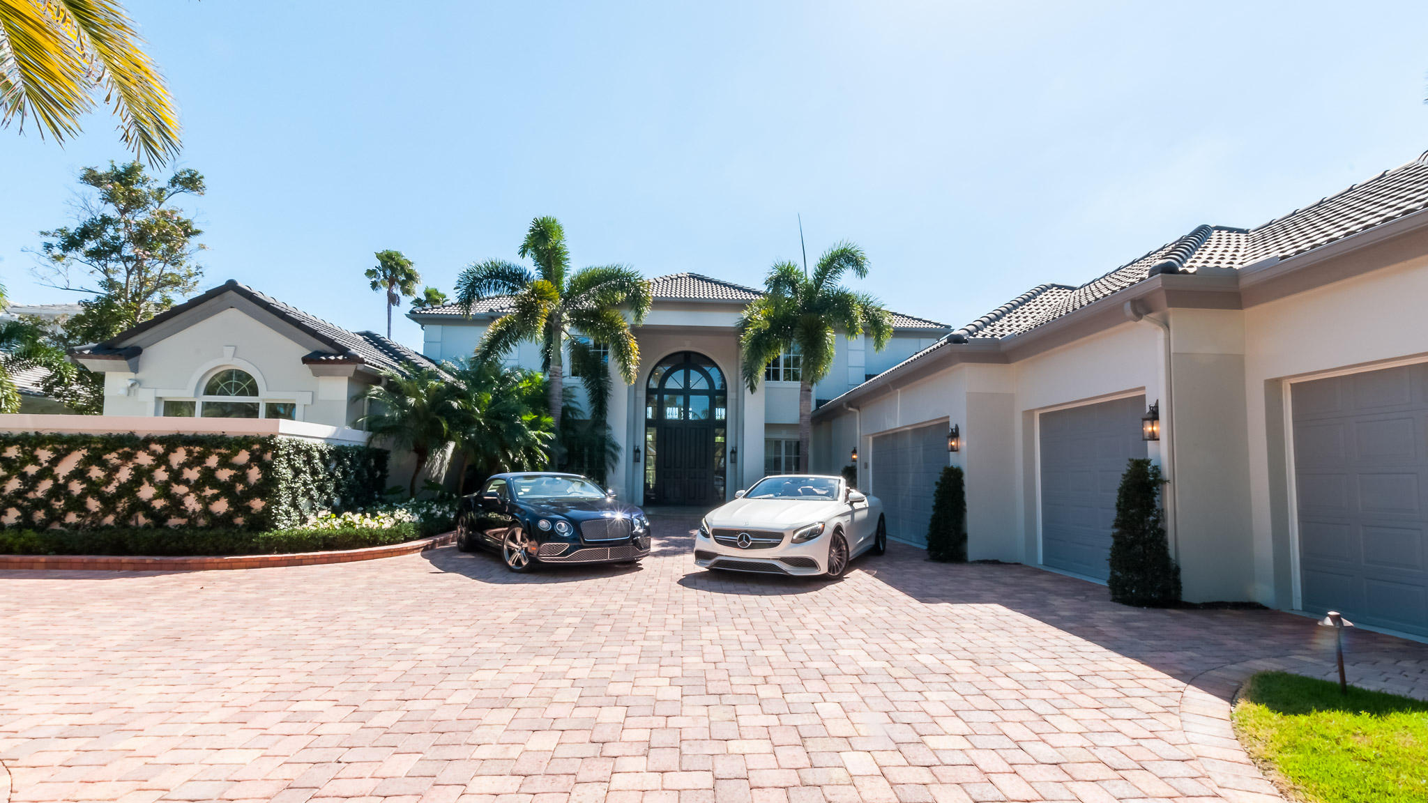 Masterfully re-modeled in 2015/2016 Designer Traditional 5 bedroom, 51/2 baths home with separate Guesthouse.Grand Foyer Entrance with mahogany doors and venetian plaster walls  throughout into living room. Dramatic curving staircase with newer hand wrought iron railings. Newer 8'' wide board solid walnut floors throughout. Full led ceiling lighting.  Designer kitchen with high end appliances , and butler pantry. Beautiful white counter tops and Italian tile backsplash/ separate wet bar for entertaining. Spectacular newer master suite & his/hers baths with artisan custom tile work and french doors leading to private terrace.  Impact doors & windows.  Also movie room/Custom design chandeliers and fixtures.Extra large laundry room- New pebble tec finished heated pool, A Must See! First class Platinum amenities & service at Admirals Cove, 45 holes of Golf, 5 restaurants, 63 slip marina, 13 har tru tennis courts, state of the art fitness center and spa.