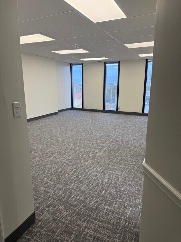 Lowest Rental Price in the Area! Newly renovated office space featuring an open floor plan, 5 private offices, and a storage room that can also be used as a coffee/break area. Recent upgrades include: Brand-new carpet New ceiling tiles Modern LED lighting Fresh paint throughout Located in a prime location just 1 mile from the ocean, this office offers exceptional value at an unbeatable price. Don't miss this opportunity to lease a professional, move-in-ready office space in a highly desirable area! 5 Private Offices 1 Conference Room Central Air Conditioning City View. 1 mile from Ocean , 1 mile from 95. Beautiful just renovated building with lobby banking, CPA's, attorneys, and many more industry tenants. The property is within the business district of retail shops, office buildings and plenty of good restaurants. One amazing property feature is assigned & public parking. In the fall of 2019, OPTIMUM BANK, took over the lobby space on the first floor of the building. Brokers Protected!!.