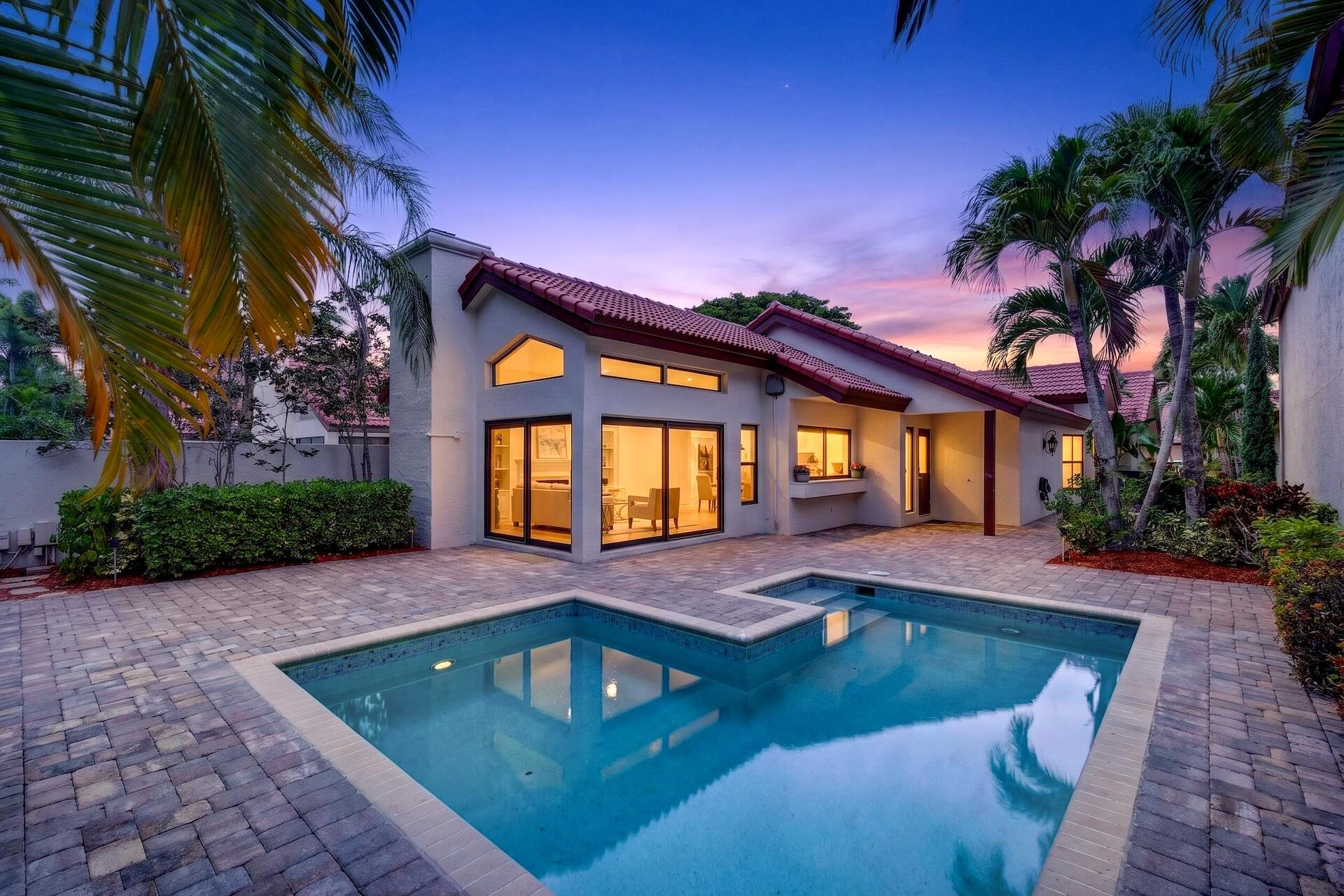 Beautifully updated pool home in the highly sought-after gated community of Town Place Club Villas in Boca Raton. This spacious one-story residence offers 2 bedrooms, 2 renovated bathrooms + plus a versatile flex space/office. Soaring vaulted ceilings, abundant natural light, tile flooring throughout, full hurricane impact windows, wet bar with wine refrigerator, and fireplace. Huge open kitchen showcases stainless steel KitchenAid appliances, granite countertops with full backsplash, and oversized island. Expansive primary suite offers a walk-in custom closet and luxurious bathroom. Enjoy a private pool and patio perfect for entertaining. 2-car garage and resort-style community amenities with pool & spa.. Prime location near Town Center Mall, Mizner Park, dining, shopping, and much more.