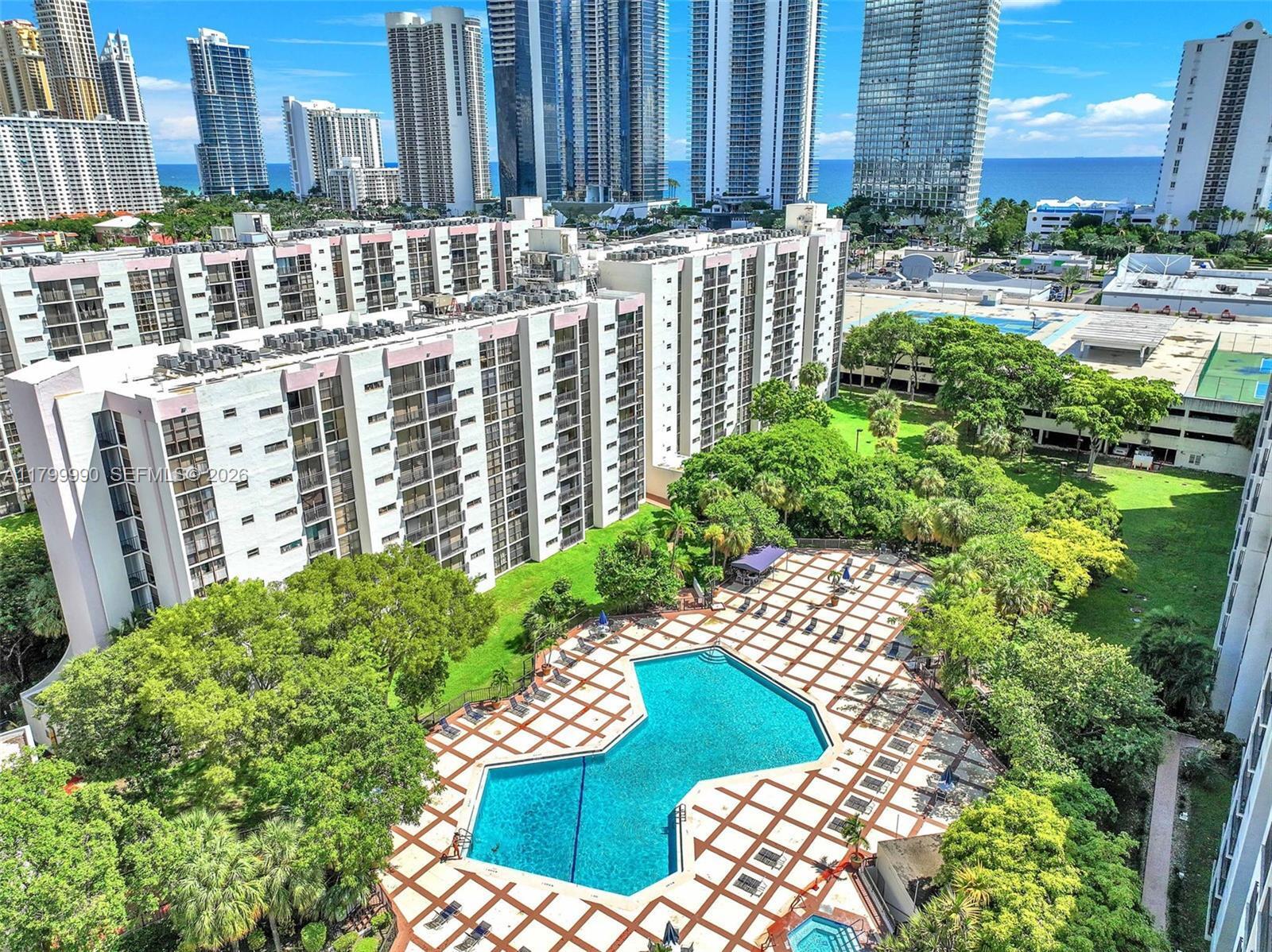 HOA was reduced by $100 in 2026, with required reserves fully included!!!!!!!!!VA Approved • Investor-Friendly • Prime Sunny Isles Location Don't miss this incredible opportunity! This bright and beautifully maintained 2- bedroom, 2-bath condo features a peaceful semi-private garden view, brand-new stainless-steel appliances, a new A/C, and elegant tile flooring—making it the ideal primary residence, second home, or income-producing property. Perfectly located just across from the beach, this condo allows immediate rentals after closing with only a quick 7-day tenant approval. Minimum lease term is 6 months, and corporate buyers are welcome, giving you unmatched flexibility. Enjoy resort-style amenities including a heated pool, newly updated gym, sauna, tennis and basketball  courts, BBQ area, clubhouse/media room, and more. The unit includes three parking spaces (1 assigned + 2 unassigned resident spaces) and cable + internet are included in the HOA. Whether you're using your VA benefits or expanding your rental portfolio—your search ends here.