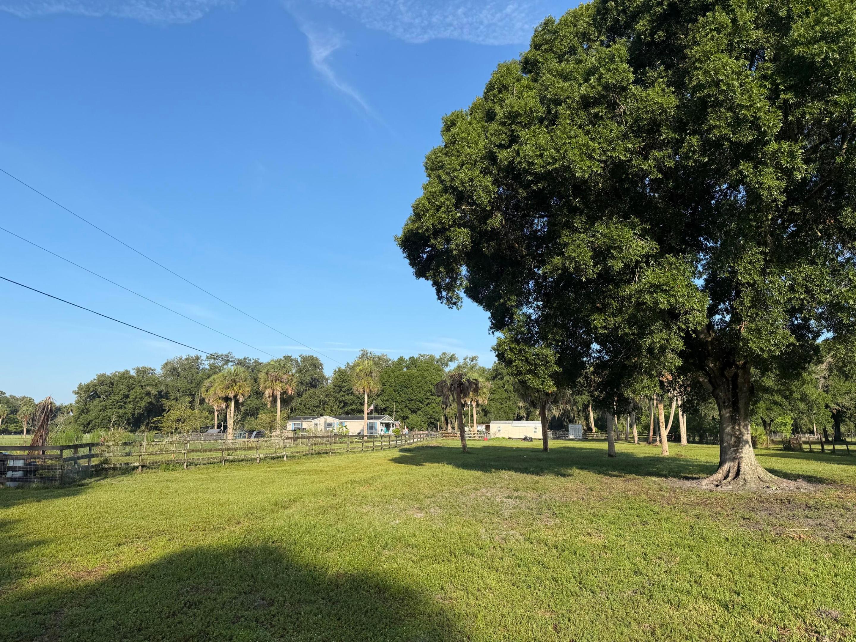 Beautiful 2.2+/-  acre lots to choose from. Both are beautiful with grandfather oaks, fenced, and 1 has 2 sheds.  Either one would like a wonderful homesite or small homestead. Bring your livestock, fruit trees, gardening gloves and house plans!! 10 minutes to Okeechobee.  There is also an adjoining property with a mobile home and pond offered for sale.  3. properties are being offered.( 2) 2.2+/- acre lots and (1)  2.2+/- Acre lot with Mobile Home and pond.