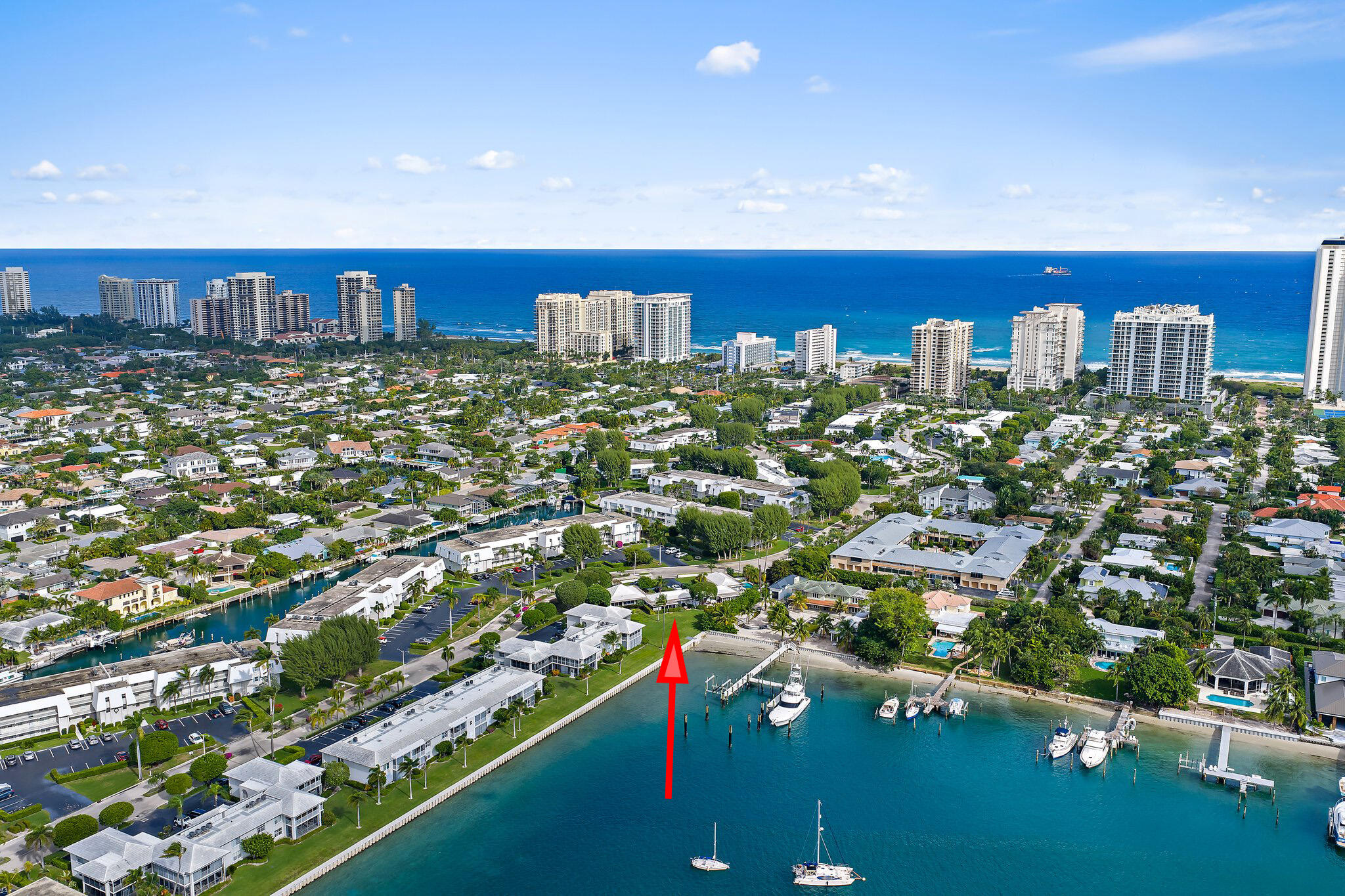 Boat docks available for rent or purchase and private beach access make this Sugar Sands villa a rare opportunity on Singer Island. Enjoy the freedom to keep your boat close to home while also having direct access to some of Palm Beach County's most beautiful beaches—an exceptional combination that sets this community apart.  One of only four unique villas in Sugar Sands, this single-story residence lives like your own ranch home, offering an open floor plan, private backyard, and patio space where owners can BBQ and entertain outdoors—a feature not available to the condominium residences within the community.  Inside, the kitchen is centered around a large island with seating, ideal for casual dining, food preparation, or gathering with guests. The 55+ community also offers resort-style amenities including one of the largest pools on Singer Island with lap lanes, shaded lounging areas, BBQ grills, plus tennis and pickleball courts. A rare chance to enjoy boating, beach access, and villa-style living in one of Singer Island's most desirable coastal settings.