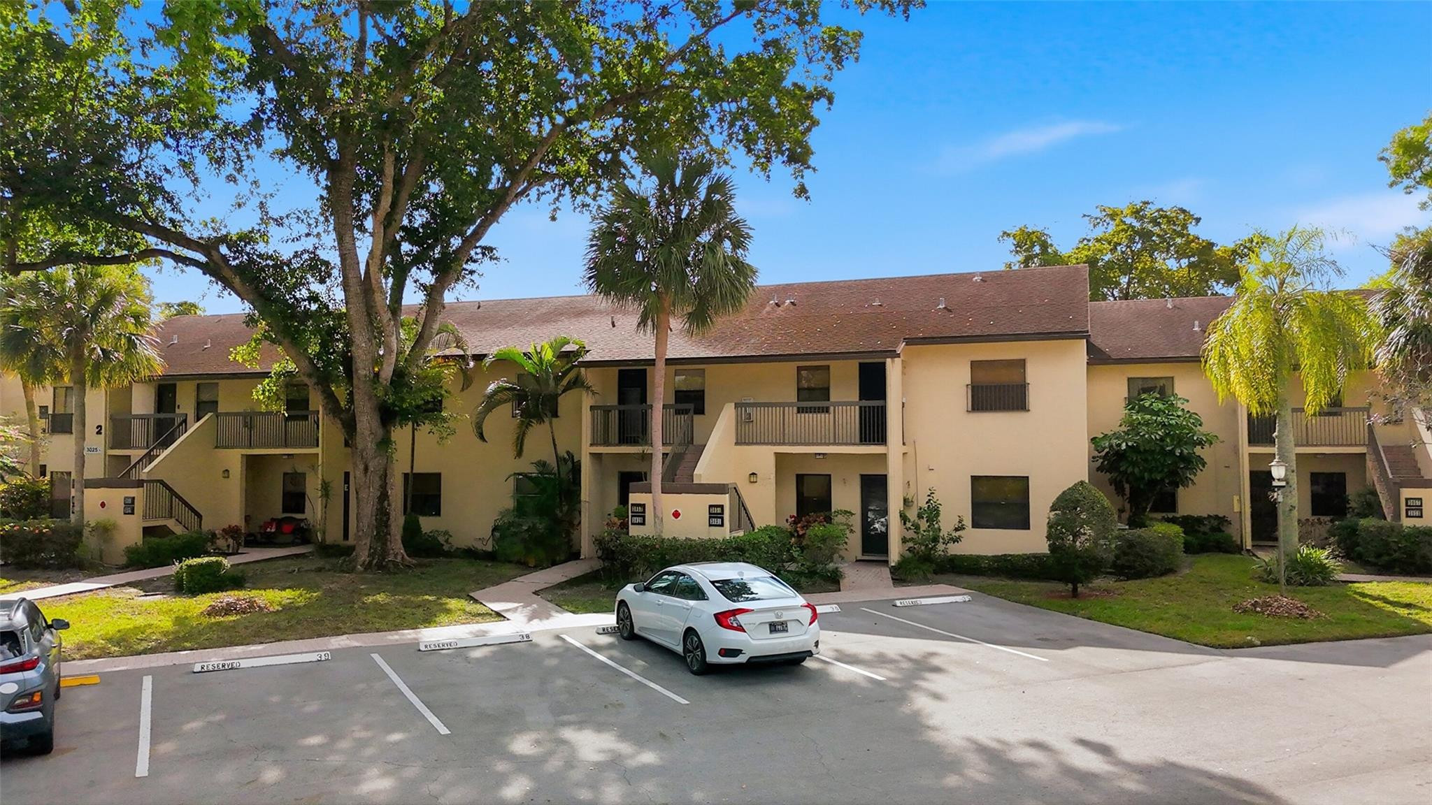 Bright and immaculate 2BR/2BA second-floor unit with serene water views, truly move-in ready!  Centrally located in the Township of Coconut Creek.  Features include a new kitchen with stainless steel appliances, washer and dryer, hi-hat lighting, and updated bathrooms.  Newer A/C and new flooring in both bedrooms.  Spacious owner’s suite and an open, airy floor plan lead to a screened-in balcony overlooking the water.  Enjoy the pool just steps away, or take advantage of The Township’s resort-style amenities at the main clubhouse, including an aquatic center, athletic club, 2 story fitness center, ballroom, 500 seat theater, free movies, live shows, yoga classes, tennis, pickleball and more.  Maintenance covers exterior building, roof, water, sewer, trash, basic cable, lawn & pest control.