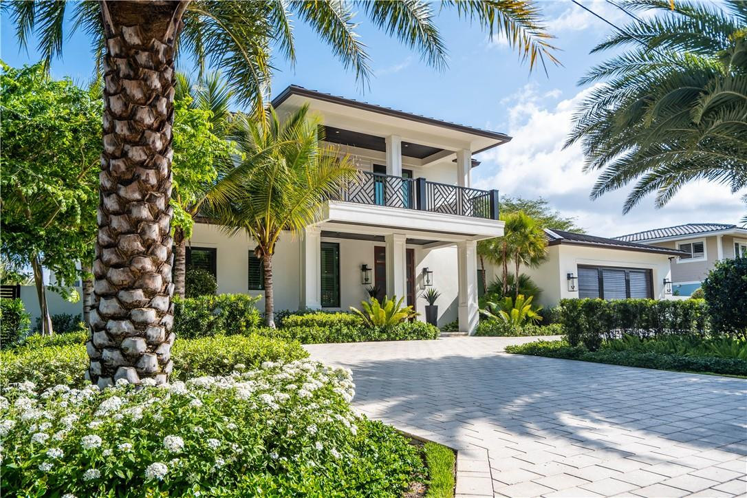 Newer construction just 4 minutes to the ocean! High-end finishes from top to bottom with all custom-made cabinetry and Wolf & Sub-Zero appliances. Expansive covered outdoor living includes a summer kitchen under the downstairs lanai and a massive primary suite balcony with both covered space and a private open-air sun deck. Nearly 1,200 sq ft 4-car garage offers room for all your toys. Propane supplies the whole-house generator, Rinnai tankless water heater, gas range, grill, and two fire pits. Dedicated space for a future elevator. Concrete dock with power stanchion. Opportunity to add on in the future to increase living space and build instant equity. Skip the hassles of building—this turnkey home is ready now and OWNER FINANCING AVAILABLE!