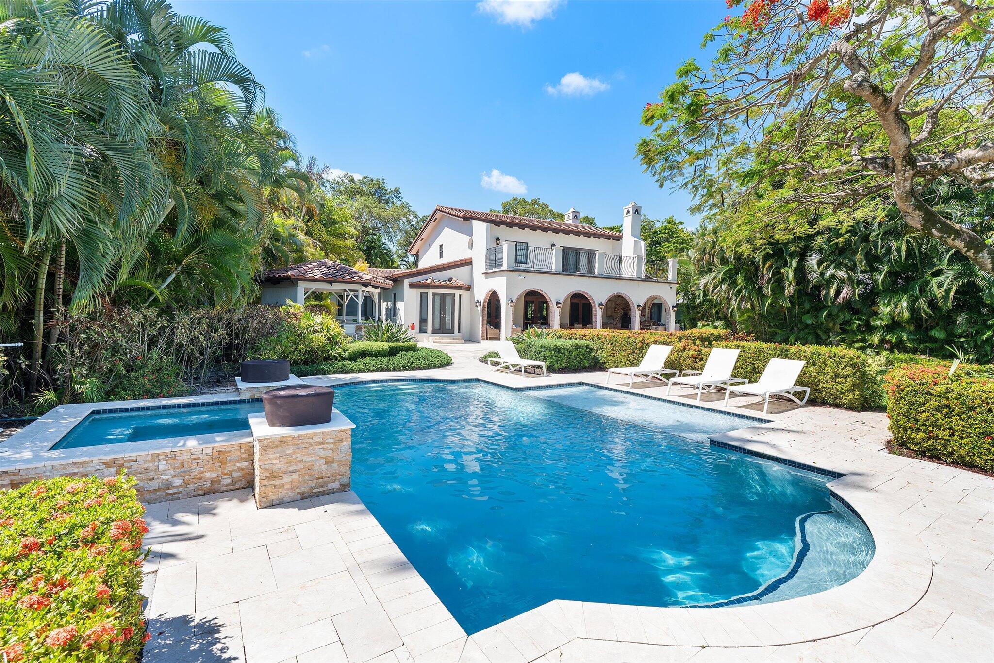 Welcome to Forever Poinciana, an Old Ft. Lauderdale residence reimagined through two year transformation offering a private, resort level living experience. This is not a renovation — it is a complete re envisioning of luxury and craftsmanship.  This serene oasis features a heated designer pool, sun shelf, and spa. The loggia is a grand outdoor living pavilion, featuring a built in grill, and a pizza oven. Perfect for entertaining.  The kitchen is equipped with premium appliances including a built in coffee system, ice maker, beverage center, wine refrigerator, dual ovens, and a warming drawer. Every detail is curated for those who appreciate quality, convenience, and the art of entertaining. This home is a timeless Ft. Lauderdale classic, in one of the city's most desirable neighborhoods