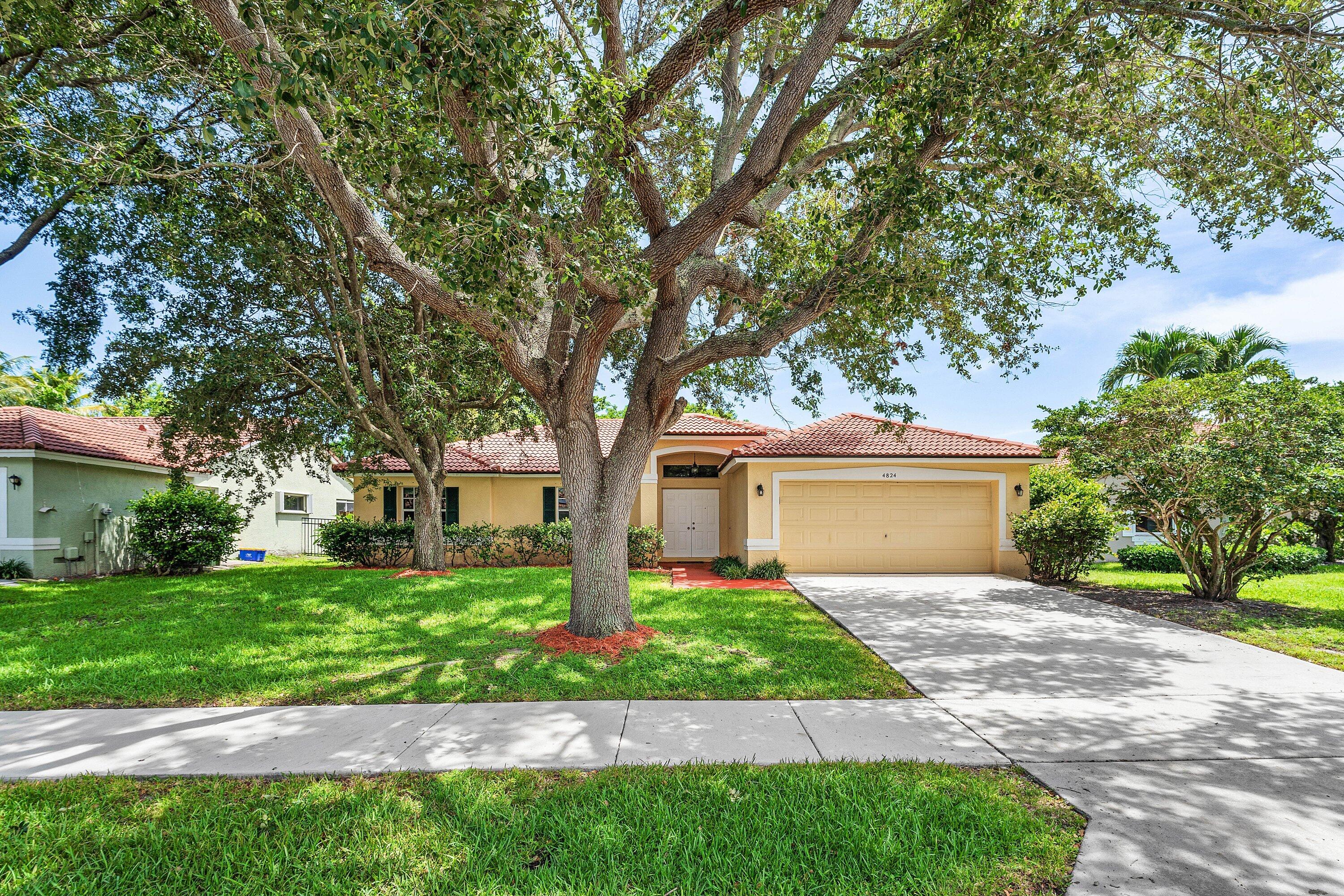 Welcome to 4824 South Lee Road, a beautifully maintained ranch-style residence located in the gated community of Lee Crossing in Delray Beach. Offering 3 bedrooms, 2 bathrooms, and 2,026 living square feet (2,588 total), this single-story home features soaring vaulted ceilings, expansive formal and casual living spaces, and a designer kitchen complete with a center island, pantry, and sunlit breakfast nook. The spacious primary suite offers a walk-in closet and spa-inspired en-suite bath, while a dedicated laundry room and oversized 2-car garage provide added convenience.  Step outside to your own private tropical retreat featuring a freeform pool, patio, and lush privacy landscaping, creating the perfect setting for both relaxation and entertaining. With low HOA and an exceptional  location in Lee Crossing, just 2 miles from vibrant Atlantic Avenue and only 3 miles from Delray's pristine beaches, this home offers the ideal balance of privacy, comfort, and convenience with the best of South Florida living.