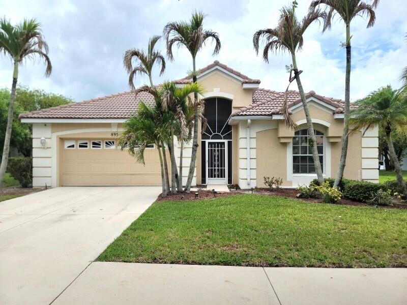 LOCATION! LAKEFRONT! This Lakefront  3 bedroom, 2 bath, 2 garage home offers the perfect blend of comfort, style, and Florida living. This home features a spacious split floor plan, tile throughout and carpet in bedrooms. The remodeled kitchen showcases granite countertops, stainless steel appliances, and gas stove! Step outside through the pocket sliders to enjoy a large covered and screened-in patio overlooking the lake. Lake Charles' newly renovated clubhouse featuring an Olympic-size pool, hot tub, tennis courts, pickleball, basketball courts, playground, and more. Residents enjoy 24-hour gated security and a prime location close to shopping, dining, PGA golf, major highways, and Clover Park, home of New York Mets spring training. See Supplement remarks below This home is a rare opportunity in one of Port Saint Lucie's most sought-after communities. Lake Charles is a place where residents can enjoy many recreational amenities such as a manned security guard gated entry, a beautiful Beach Clubhouse with a magnificent heated pool & spa, library, media center, lighted tennis/pickleball courts, basketball court, 2 shuffleboard courts, bocce court, horseshoe game, playground, picnic with BBQ areas, jogging, biking, preserves and connecting lakes for boats that do not run on gas. Association fees also include landscape care, basic cable and internet. All documents and application can be found on the website LakeCharlesHOAcom as well as further information about the community.