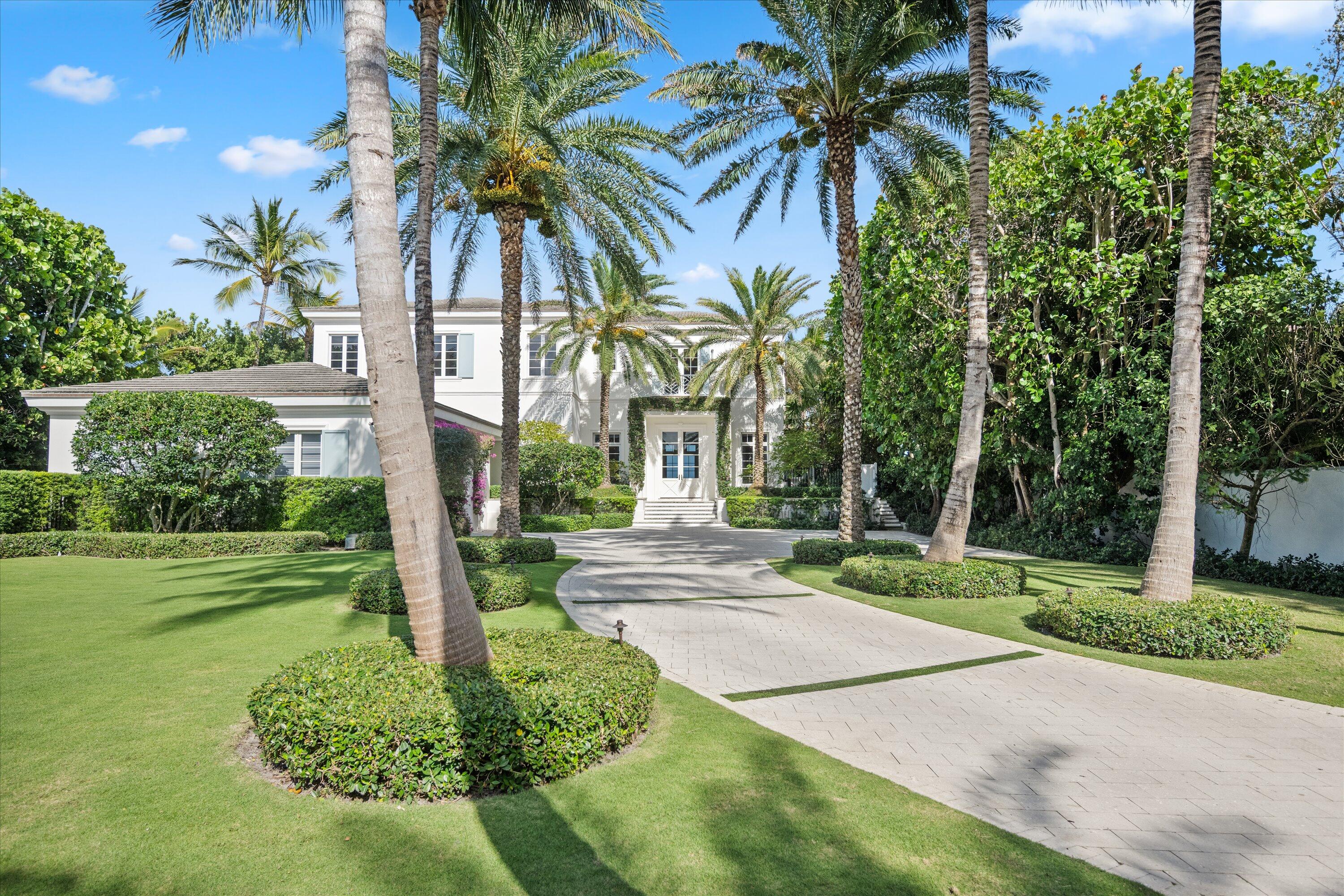 Gated Oceanfront Estate completely rebuilt in 2017 is set high above the dune on one of Gulf Stream's most desirable beaches. Designed by Rustem Kupi Architects, the residence offers extraordinary privacy and sweeping ocean views from nearly every room. The 7,854± total square foot floor plan includes five bedrooms, six full baths, two powder rooms, and a ground floor guest suite. Sun-filled interiors showcase soaring ceilings, European white oak and limestone floors, and seamless indoor/outdoor living. Outdoor amenities include a saltwater pool and spa, lush tropical landscaping, and private beach access.