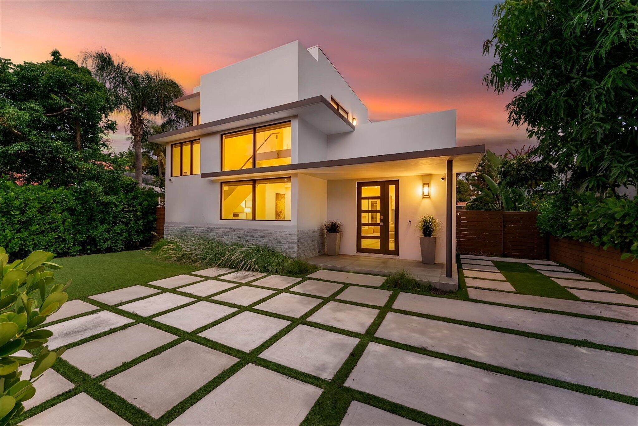Built in 2021, this gated property offers a rare advantage over nearby new construction-a full guest house. Just two streets from Flagler Dr in Historic Northwood, the property features nearly 2,800 SF of combined living space, including a 3-bed, 2.5-bath main home and a private 1-bed guest house with its own kitchen, living room, full bath, washer/dryer, and private entrance. Perfect for multigen living, extended guests, a private office, or rental income. The main home features an open-concept floor plan with a chef's kitchen, oversized island, spacious living and sitting areas, and seamless indoor-outdoor living. Enjoy a beautifully landscaped, fully fenced property with automatic front and rear gates, offering exceptional privacy just minutes from Palm Beach island, downtown WPB, shopp ing, the Intracoastal, and so much dining.
