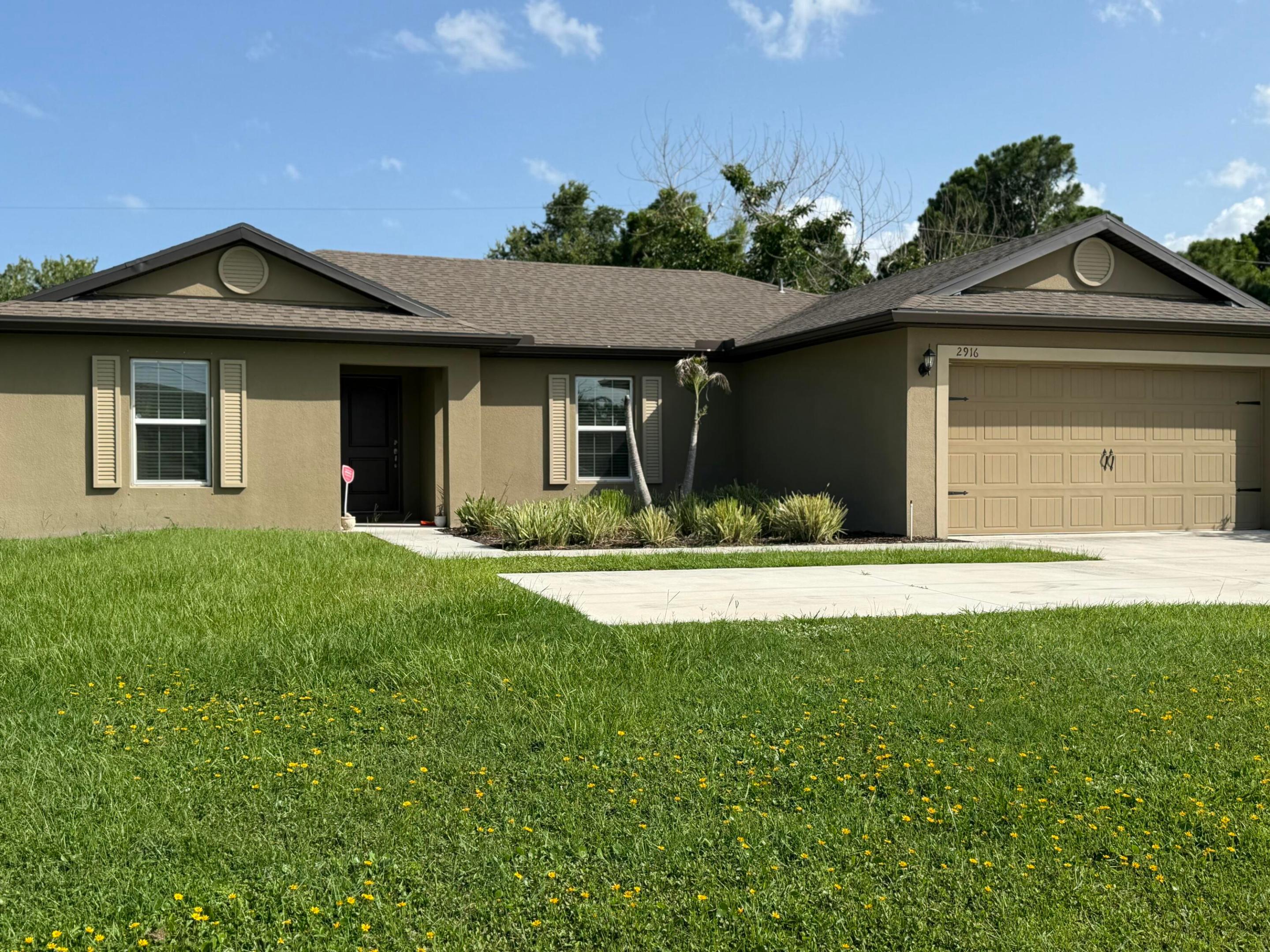 Welcome to this beautiful 2022-built home offering 3 bedrooms, 2 bathrooms and a spacious open-concept floor plan designed for comfortable Florida living. Situated on an oversized lot in desirable East Port St. Lucie, this home combines modern finishes with an exceptional location.  Inside, you'll find luxury vinyl plank flooring throughout the main living areas. The stylish kitchen features granite countertops, stainless steel appliances, and plenty of cabinet space, flowing seamlessly into the living and dining areas—perfect for entertaining.   Conveniently located just minutes from Green River Parkway, Jensen Beach, shopping, dining, parks, and major commuter routes, this move-in ready home offers the perfect blend of style, space, and location.