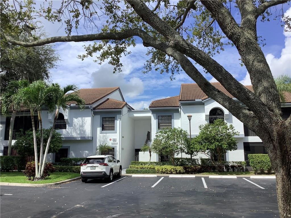 Location, location! Buying a home in a prime location, is every buyer's dream, but when you can combine location w/ the best price, the best community, & the best unit, it becomes a dream come true! This amazing first floor, unit have it all!  Located in beautiful Platina, gated community, no age restriction, very clean, bright, & move in ready. Completely private screened patio, newer AC, large living room & dining area, kitchen with pass through window and breakfast nook, white tile floors throughout the living area and pristine white carpet in bedrooms! It’s perfect for a winter getaway or second home! HOA includes everything; cable, internet, water, inside/outside extermination, and all the amenities, resort style pool, tennis courts, all this at less than 15 minutes from the beach.