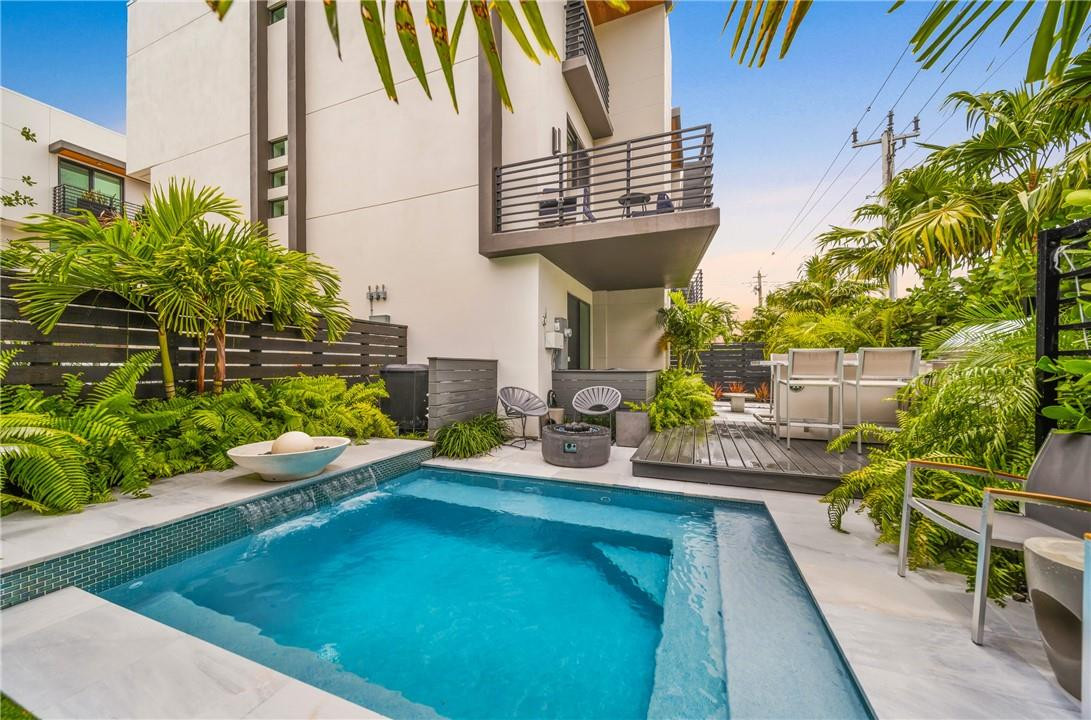 PRIVATE POOL | WELCOME TO YOUR MODERN OASIS! THIS 3-LEVEL, 3-BED, 3.5 BATH HOME IS THE EPITOME OF STATE-OF-THE-ART LUXURY. WITH ITS SPACIOUS LIVING ROOM, STUNNING KITCHEN, AND DECK OVERLOOKING THE POOL AND WATERFALL IT'S PERFECT FOR SEAMLESS, EFFORTLESS, HOSTING. EVERY DETAIL, FROM THE MATTE WHITE TILES TO THE CUSTOM CLOSETS, EXUDES QUALITY AND STYLE. STEP IN TO YOUR OWN PRIVATE OUTDOOR PARADISE WITH A FABULOUS SPLASH POOL, MESMERIZING LIGHTS, AND CUSTOM LANDSCAPE. THE RAISED DECK WITH A GRANITE COUNTER BAR SETTING THE STAGE FOR GATHERINGS. PLUS, EVERYTHING IS CONTROLLED VIA SMARTPHONE. CONVENIENTLY LOCATED NEAR GATEWAY CINEMA AND THE GALLERIA MALL WITH FINE DINING & THE WHITE SANDY BEACHES OF FT. LAUDERDALE JUST STEPS AWAY. DON'T MISS YOUR CHANCE TO OWN THIS HOME.