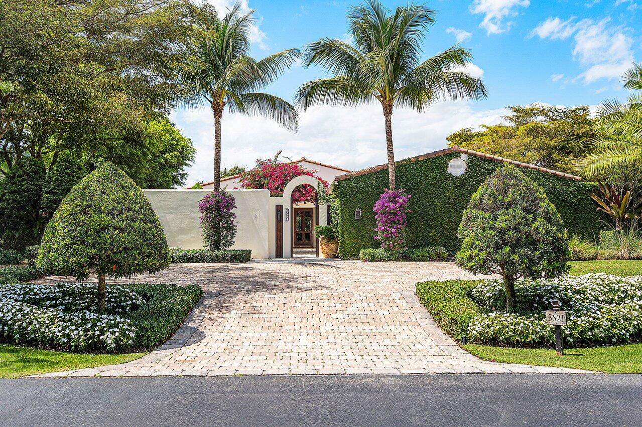 Located just steps from the horse show, this pristine property is approximately 3/4 of an acre. With panoramic waterfront views from all main living areas, privacy is at the forefront for this three bedroom plus office, three and a half bathroom home.  3600 square feet of  immaculately designed transitional style living is unmatched. 
Oversize bedrooms and bathrooms with ample  storage in custom closets. A large office space with additional storage closet. Extra deep two car garage plus golf cart garage with built-in storage.
Infinity edge pool with sun shelf overlooks the large lake with stunning west-facing views for spectacular sunsets.