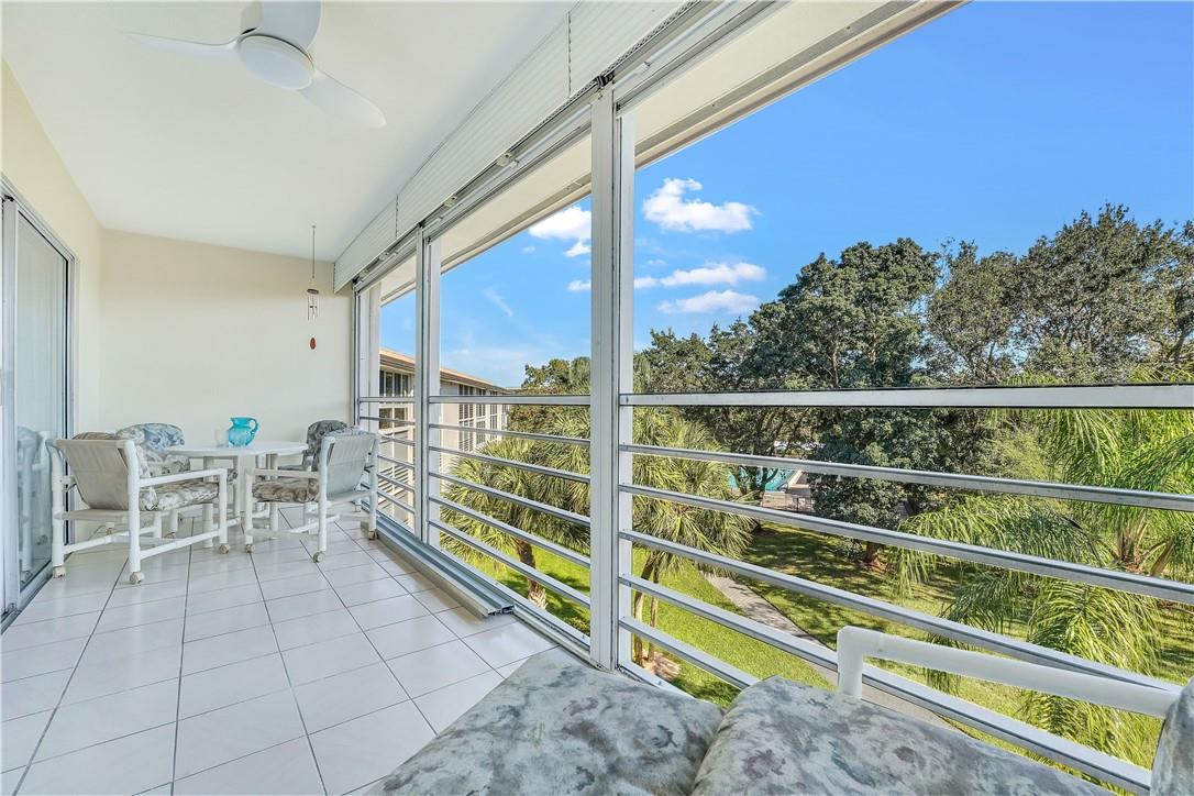 PERFECT opportunity to own a BEAUTIFULLY RENOVATED Condo! Quiet, light and bright, very private patio with a beautiful view of the trees and the distant pool area. Not facing any other patio. Smooth ceilings with crown molding. All new chandeliers, ceiling fans and plantation shutters. Wide plank oak luxury laminate floors, easy on the feet. Completely renovated kitchen, all  new stainless appliances, totally renovated bathrooms with curb less shower in primary bath for easy access in and out of the shower. A/C 5 yrs, recently serviced, water heater 3 yrs. FURNITURE INCLUDED. Laundry is one door away. ASSOCIATION REQUIRES 20% DOWN & 1 OCCUPANT 55+ GOLF, THEATER, GYM, POOLS BUILDING PASSED 40 YEAR INSPECTION.