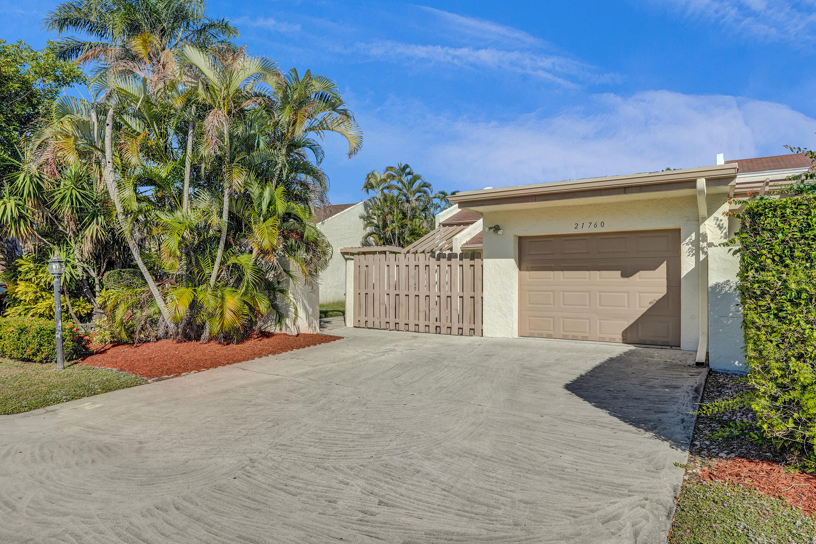 Discover this beautifully remodeled 2-bedroom, 2-bathroom villa, located in a tranquil community in the heart of Boca Raton. This home boasts sleek tile flooring throughout, an open-concept design, and soaring vaulted ceilings for a bright and modern feel. A large kitchen with granite counter-tops and stainless steel appliances. Equipped with impact windows and doors, enhanced by elegant and modern blinds. A generously sized master bedroom featuring a huge walk-in closet and a stunning, spacious bathroom. A fully enclosed wraparound yard. Centrally located, with an easy access to major roads, restaurants, shopping malls, places of worship and much more.