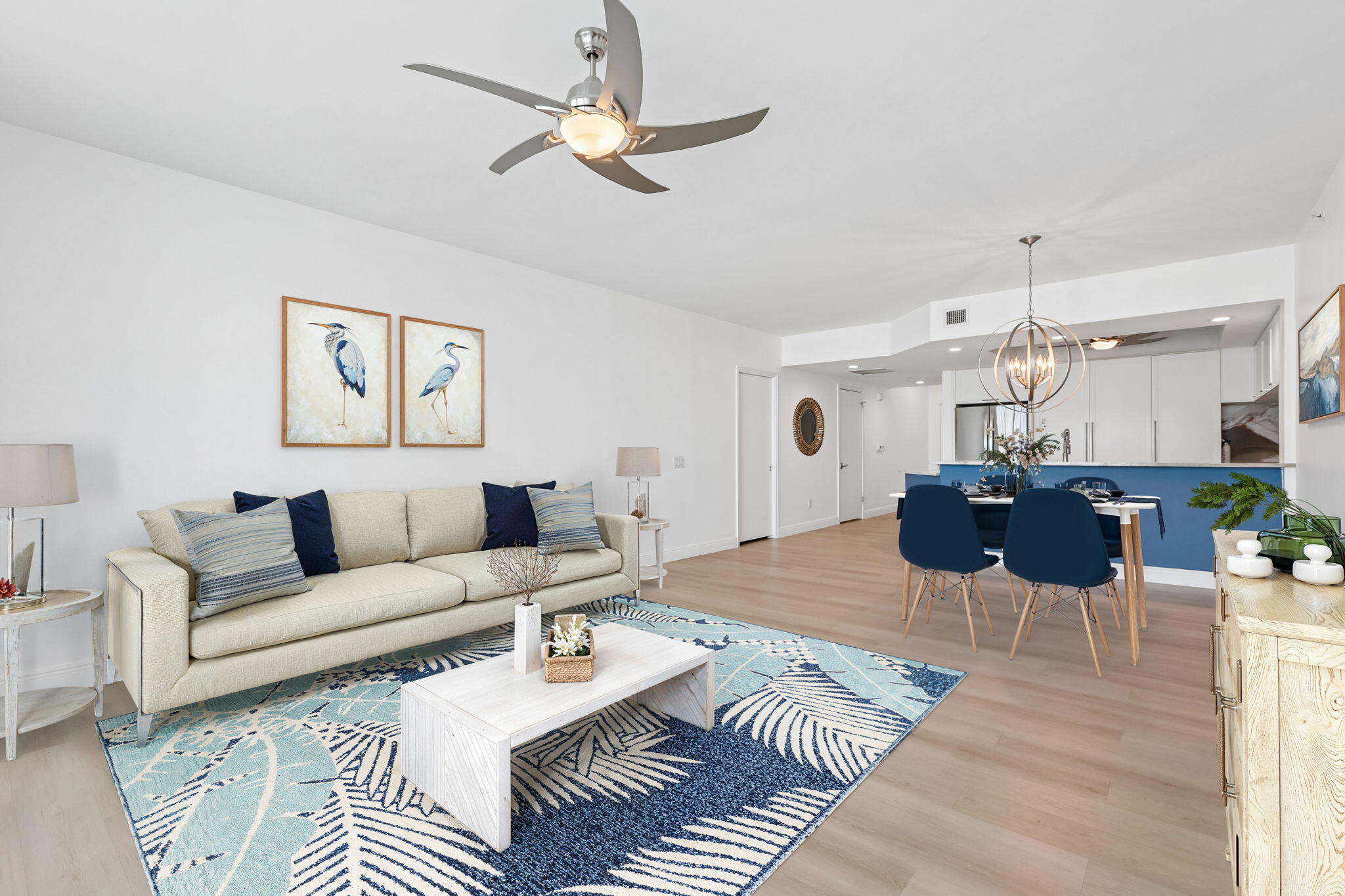 Breathtaking Intracoastal & ocean views from this updated 12th-floor 2BR/2.5BA residence. Features include a beautifully designed kitchen with white cabinets, granite countertops & backsplash, newer SS appliances, fresh paint, luxury vinyl flooring throughout (NO carpet), 5" baseboards, frameless shower doors, impact floor-to-ceiling sliders/windows with custom shutters, newer A/C, tasteful lighting & ceiling fans. Spacious guest suite includes private bath & large walk-in California Closet. Full-size washer/dryer in unit. Resort-style amenities: manned gate, tennis, pickleball, gym, sauna, steam room, heated pool, grills, valet, billiards, social room, marina next door & Publix across the street. Motivated seller open to creative financing options. Hidden gem in Palm Beach County!