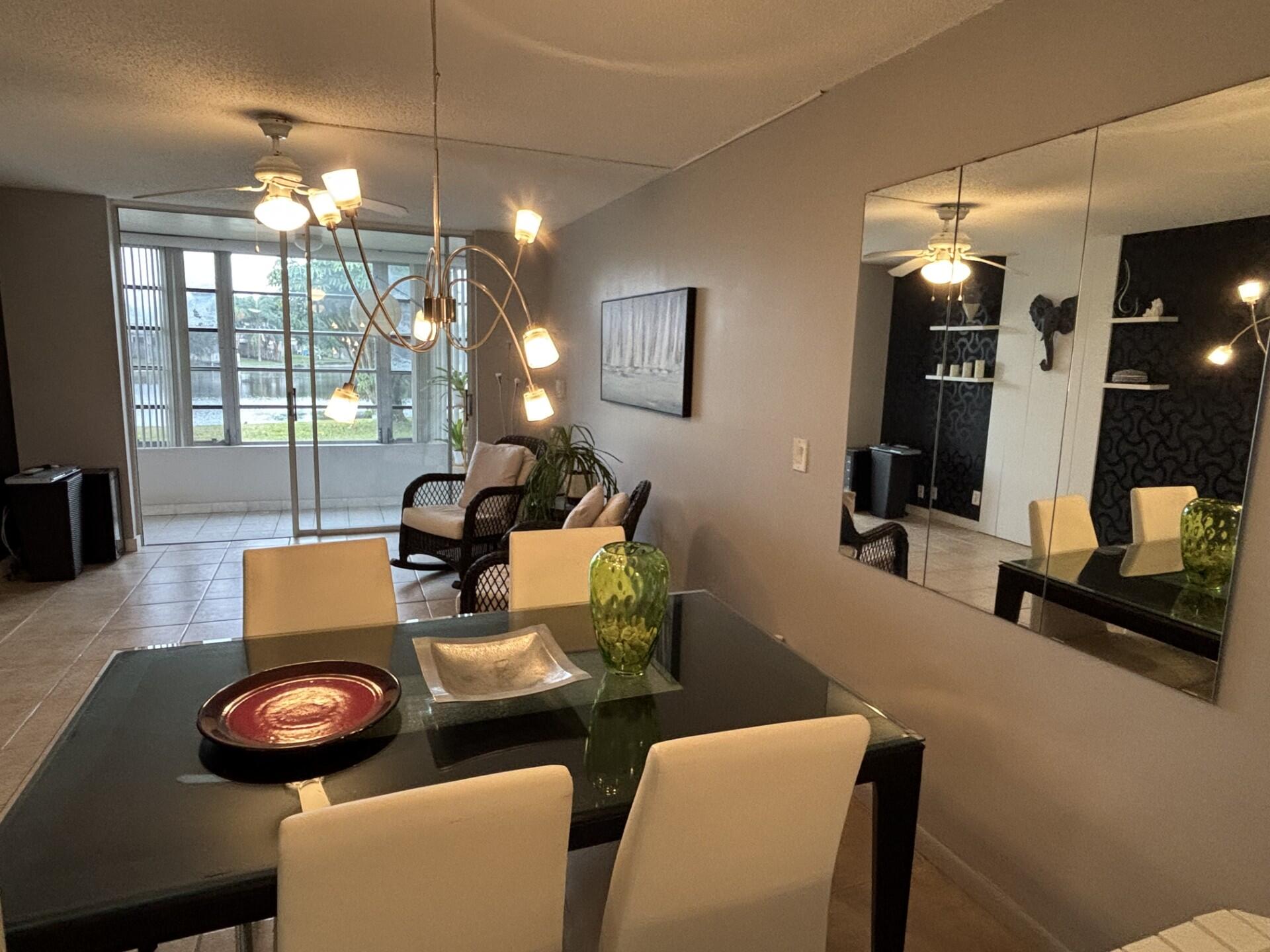 Take advantage of this drastic price reduction. Welcome to THIS BRIGHT and STUNNING unit in a great 55+ community located in the heart of Broward County, with all tile floors,  Peaceful View from your enclosed patio.  Complex is immaculate & well maintained.  Centrally located near shops, restaurants & City Community Center. Minutes from the Beach & both Major Highways. This Community includes courtesy bus who takes you on a short ride to many places  of interest. Maintenance includes Clubhouse, free golf, GYM, Tennis, Shows, Movies, State - of- Art, Fitness Center, Outside & Inside Pools.  No rentals permitted. THE ASSOCIATION CLAIMS ONE RESIDENT 55+ MINIMUM $2,400/MONTH INCOME, 20% DEPOSIT IF FINANCED OR 10% IF CASH. MEASSURES ARE APROXIMATE. SUBJECT TO ERRORS.