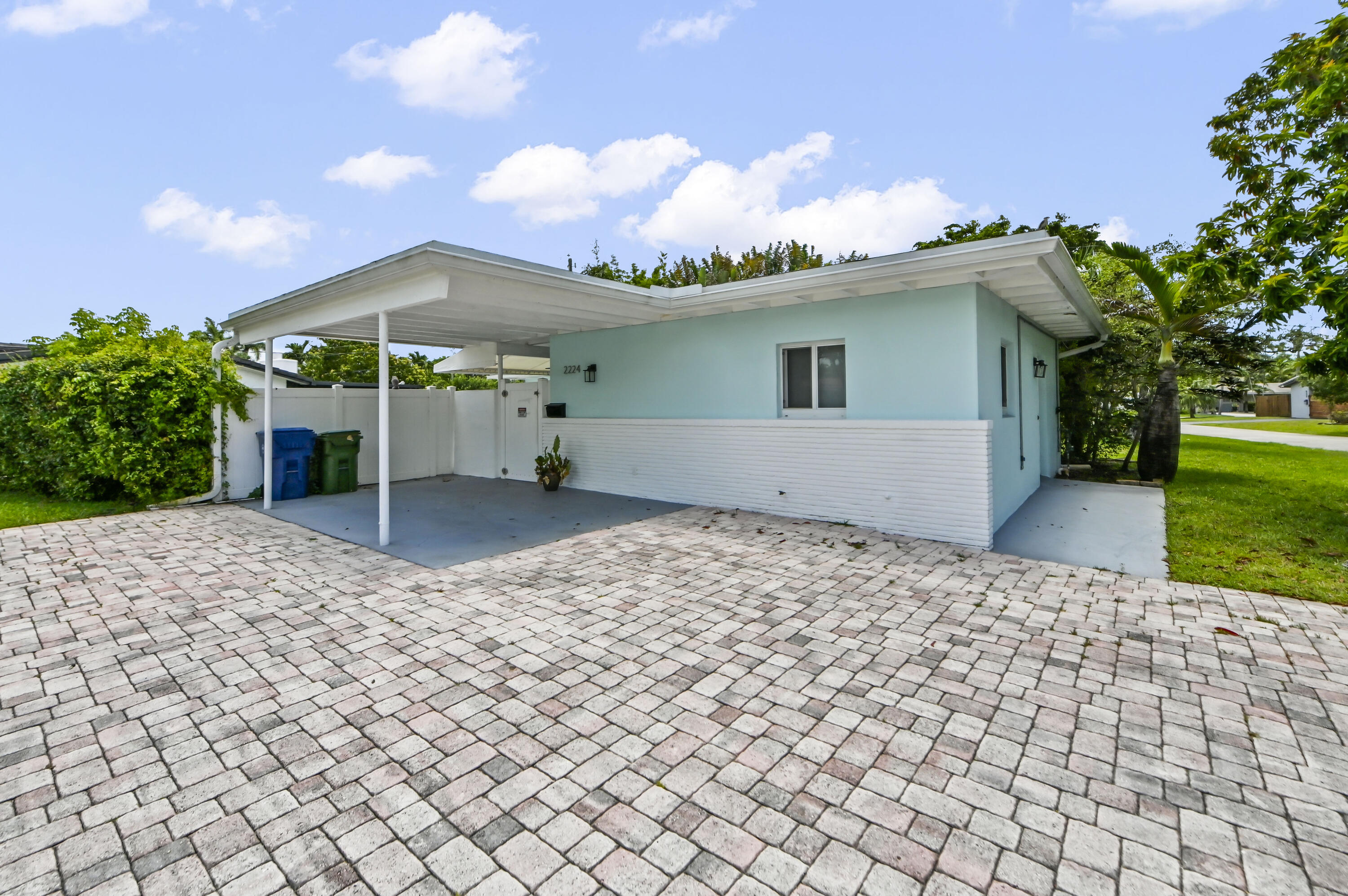 Located in the desirable Hillbrook community with NO HOA, this charming 1-story corner lot home offers 1,700 sq ft of comfortable living space with 3 bedrooms and 2 bathrooms. Features include impact windows, an attached carport with a circular driveway, spacious living and dining areas, and a kitchen with a quartzite waterfall countertop bar, custom cabinets, appliances, and ample storage. The laundry area is equipped with a full-size washer and dryer for everyday convenience. Both bathrooms have been fully renovated with the primary bathroom highlighting a rainfall shower and dual faucets. Enjoy outdoor living with an open patio, private pool, and fenced backyard. Recent updates include a 2021 roof, 2024 AC, and 2022 upgrades featuring updated kitchen, appliances, refrigerator, washer and dryer, main and secondary flooring, master and guest bathrooms, light fixtures, ceiling fans, and built-ins.  A great opportunity to enjoy comfortable living with modern improvements and no HOA restrictions.