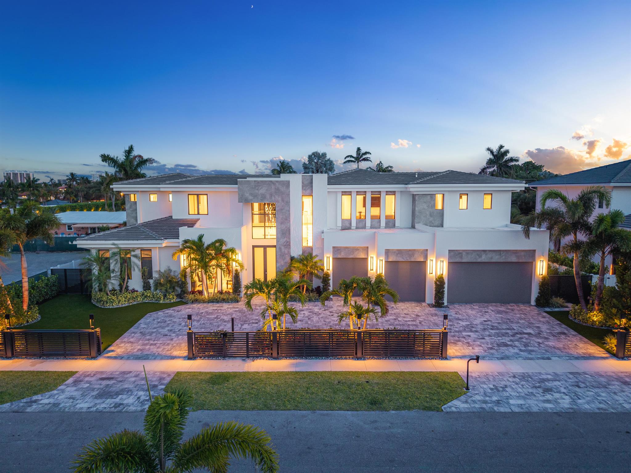 This isn't just another home in Boca Villas. This is the one. Forget comparisons—this residence doesn't follow the rules. It rewrites them. It's your personal sanctuary, your private escape, and your ultimate stage for unforgettable entertaining. From the moment you step inside, you're wrapped in a sense of calm, an involuntary smile, and filled with excitement for everything this dream home promises.

Born from a bold vision and designed to stun, this double-lot masterpiece fuses casual elegance with grand, open-concept living. Think wide, flowing spaces that bring the outdoors in—yet still feel cozy enough for a movie night in fuzzy socks and candlelight. And then there's the showstopper: the wrap-around layout. It hugs the sparkling pool like a secret treasure, revealing water -- views from nearly every room. Glide into the massive great room yes, it actually deserves the title and discover a chef's kitchen that dreams are made of, full size wolf and subzero appliances, with a complete scullery and second set just behind. Hosting dinner parties, holiday feasts, Sunday brunch or hosting a show on Food Network? You've got this covered in style.

On the main floor, the primary suite awaits like a five-star resort in a tropical paradise. Wake up to poolside serenity and unwind with a luxurious soak in the spa-sized tub. Custom closets are your private boutique, complete with led lighting and glass shelving. 

Upstairs? There's even more to love a second living space hangs or game nights, a second laundry room. You'll find a VIP suite from which your guests will never want to leave, and three beautifully appointed bedroom suites, each with a private bath and custom-built closet.

But wait, it gets better.
Slide those doors open and welcome to your private oasis. A detached entertainment haven beckons, perfect for entertaining or a quiet al fresco meal. Fire up the grill in the summer kitchen, pour drinks at the bar, catch a game on the waterproof SunBrite TV, there's even a detached full bath. Whether it's a sunset soirée or an all-out celebration, this backyard was built for making memories.

Location? Prime. You're a short stroll from the lively energy of Mizner Park and just a block from the serene beauty of Lake Wyman. Restaurants, shops, nature, nightlifeit's all right here.

You'll live in a home with unparalleled attention to detail, quality construction, and all the upgraded inclusions. Automatic shades on every window, drapes in the suites, full home generator, music in every room, televisions installed throughout (even outdoors!), control4 lighting system, commercial style wifi network,  security cameras, automatic gate, wireless pool control, all at the touch of a button, or better yet from your phone.

This isn't just a house.
It's a lifestyle. A vibe. A once-in-a-lifetime kind of home for those who want it all and then some.
