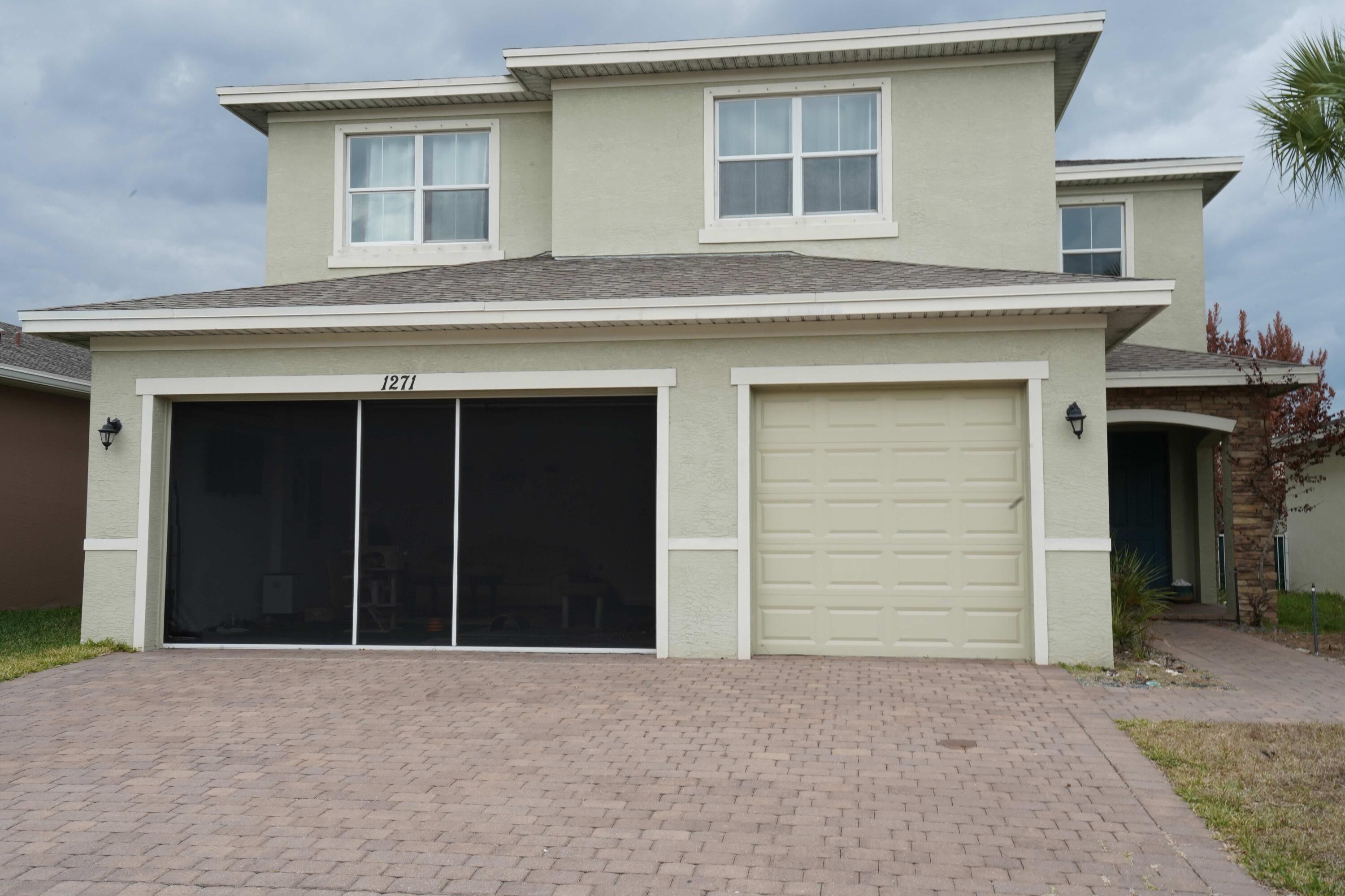 Motivated seller!  Experience the Pinnacle of Port St. Lucie Lifestyle in Vizcaya Falls Step into over 3,600 square feet of masterfully designed open-concept living in this stunning two-story, 5-bedroom, 4-bathroom estate. Located within the prestigious, private gated community of Vizcaya Falls, this home seamlessly blends sophisticated interior detail with the relaxed, outdoor-centric lifestyle that defines the Treasure Coast. The Home From the moment you enter the beautiful foyer, you are greeted by custom lighting and elegant 18-inch ceramic tile with a marble finish that flows throughout the main level. Chef's Dream Kitchen: Features granite countertops, a deep basin sink with a high-water faucet, an oversized walk-in pantry, and recessed lighting. It overlooks the living and dinette areas, keeping you connected while entertaining. Work from Home in Style: A dedicated main-floor office/den boasts a customized wrap-around built-in desk, perfect for the modern professional. Master Retreat: The expansive master suite serves as a private sanctuary with its own spa-like bath. The "Lifestyle" Garage: The three-car garage features a roll-down "Lifestyle" screen door, allowing you to keep the doors open and enjoy the Florida cross-breezes without the bugs. Outdoor Living: Step through sliding glass doors to a brick-paver patio--partially covered for shade--ideal for morning coffee or weekend BBQs. The Community: Vizcaya Falls Living here means access to resort-style amenities that feel like a permanent vacation: Lakefront Clubhouse & Pool: A massive, gorgeous pool overlooking the water. Family Fun: A dedicated kids' splash zone with waterfall toys and play areas. Active Lifestyle: Tennis and basketball courts, plus extensive walking trails surrounding the lake, featuring integrated workout and stretching stations. Location & Convenience Perfectly situated for families and commuters alike, you are minutes away from top-rated schools and have quick access to I-95 and the Florida Turnpike, making travel to the Palm Beaches or Orlando a breeze. SELLER MOTIVATED: This home is priced to move, and the owner is offering very aggressive buyer concessions. Whether you need help with closing costs or a rate buy-down, we are ready to make a deal happen! Don't miss out on this Port St. Lucie gem.