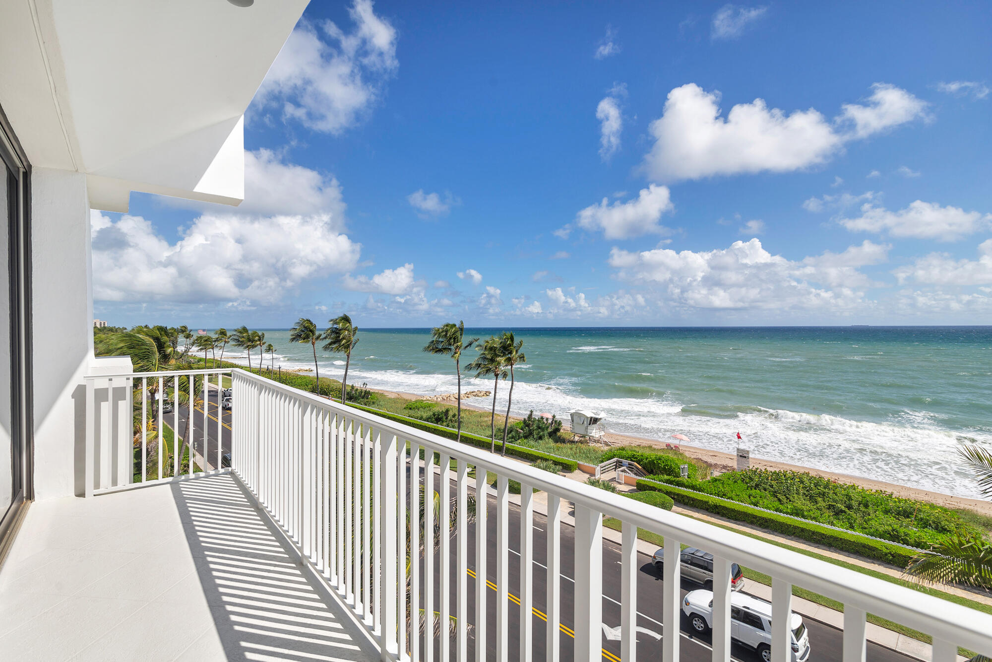 Pristine 3-bedroom, 3.5-bath top-floor residence capturing picturesque ocean views. The open concept living and dining areas feature beautiful wood flooring and extend to East and North facing balconies, creating a seamless indoor-outdoor flow. The bright kitchen includes high end appliances and a charming breakfast nook. A spacious primary suite and two guest bedrooms each with private ensuite baths provide comfort and privacy. Additional features include an in-unit laundry room, dedicated storage, and two garage parking spaces. Ideally positioned near Worth Avenue, this residence offers convenient access to designer shopping and gourmet restaurants. Experience the luxury and lifestyle of Palm Beach living.