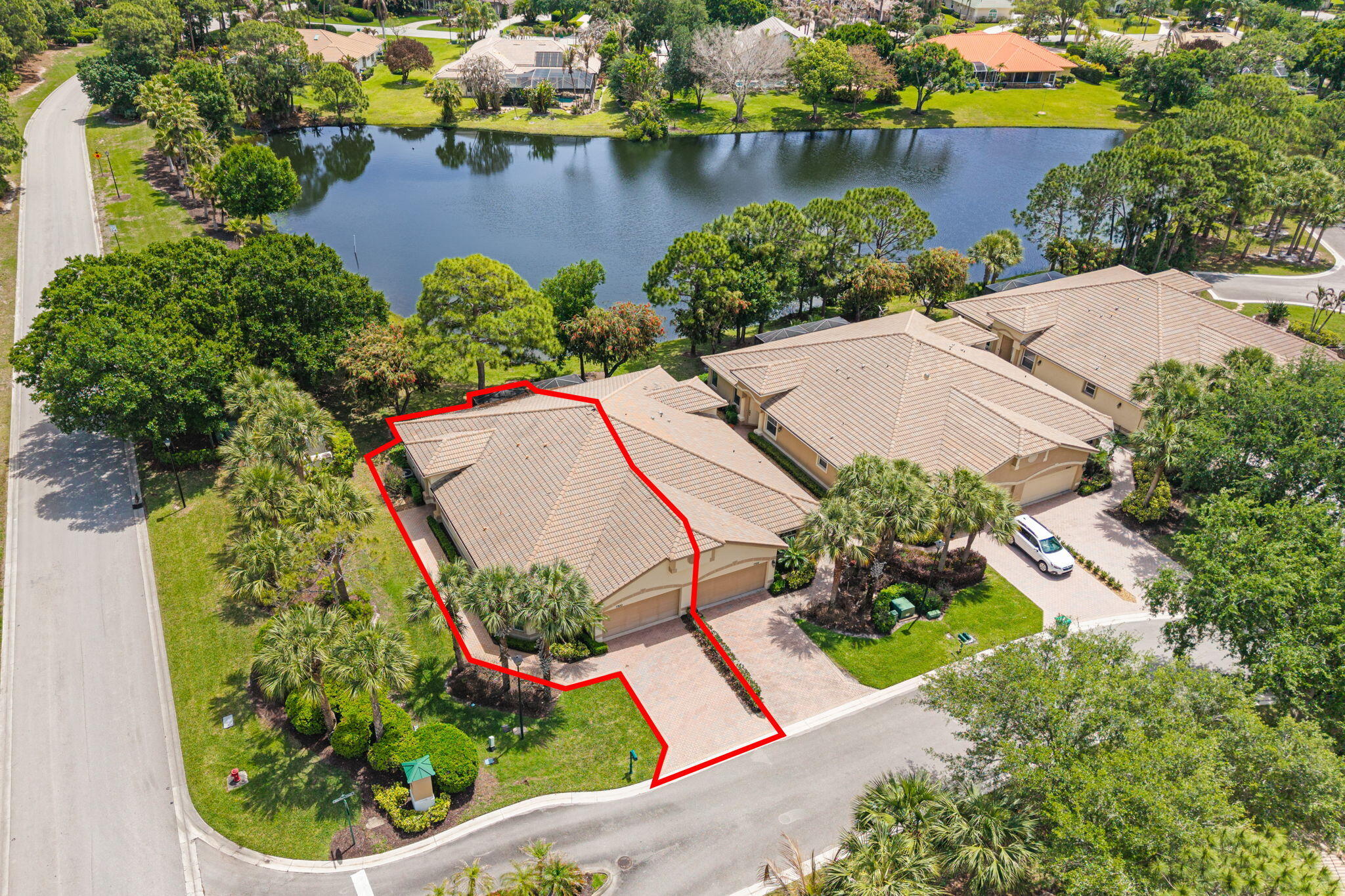 This rare gem offers the ultimate in privacy- an end-unit with no side neighbors and the lake right behind you. Get ready to enjoy your coffee every morning with a sunrise over the lake! Nestled in the prestigious Reserve section of PGA Village, you're welcomed daily by lush, mature Florida landscaping and breathtaking natural beauty. Willow Pines is one of the few communities in PGA Village with its own private community pool. Inside, the home feels light, bright, and spacious with tray ceilings, plantation shutters, and beautiful tile flooring throughout the main living areas. The thoughtfully designed split-bedroom floor plan includes a versatile den/office, making it perfect for guests. Furniture is negotiable.