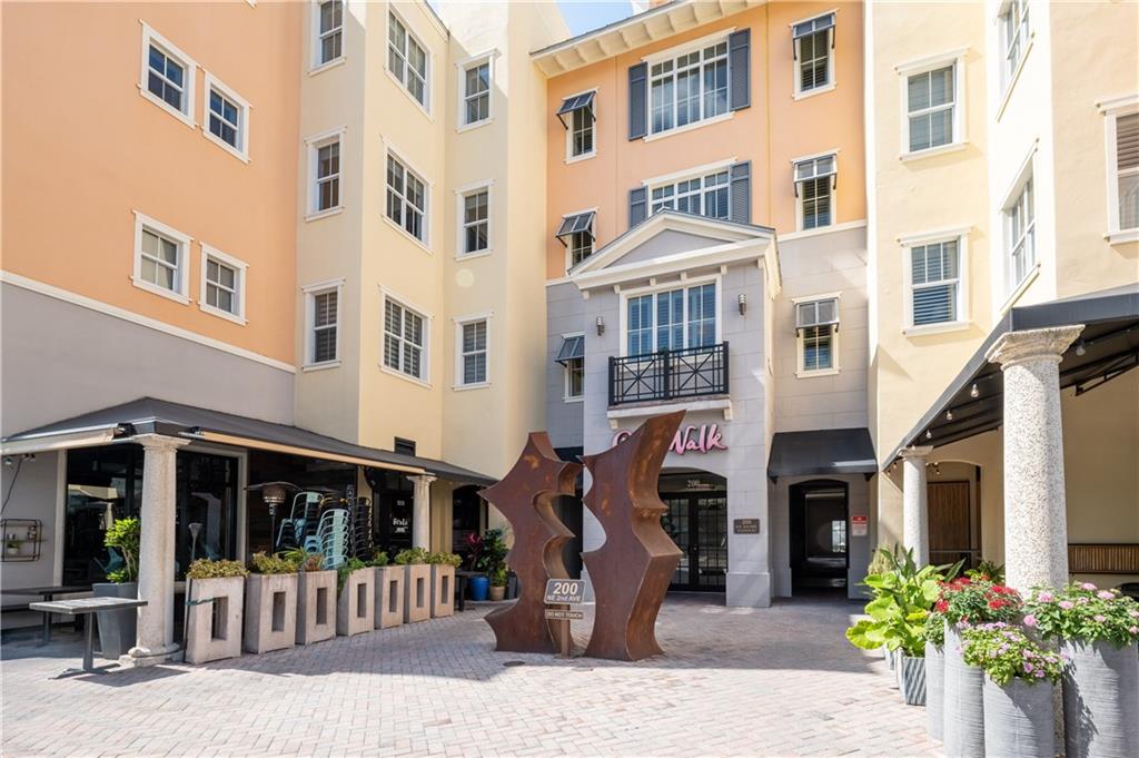 Fabulous location with spectacular sunset views from top floor condo in desirable City Walk at Pineapple Grove! Just Steps from Atlantic Ave. dining, shopping, nightlife & walking distance to Delray Beach oceanfront. This gorgeous unit features updated fixtures/finishes throughout providing fabulous gourmet kitchen with granite counters, stainless steel appliances & custom cabinetry. Primary Bedroom features Large walk-in closets and in suite bath with double sink vanity, water closet, soaking tub and shower with custom stonework. Unit provides a split floor plan along with in unit laundry room + covered parking.  Don't miss the opportunity to make your vacation spot become your New Home or Investment Property!