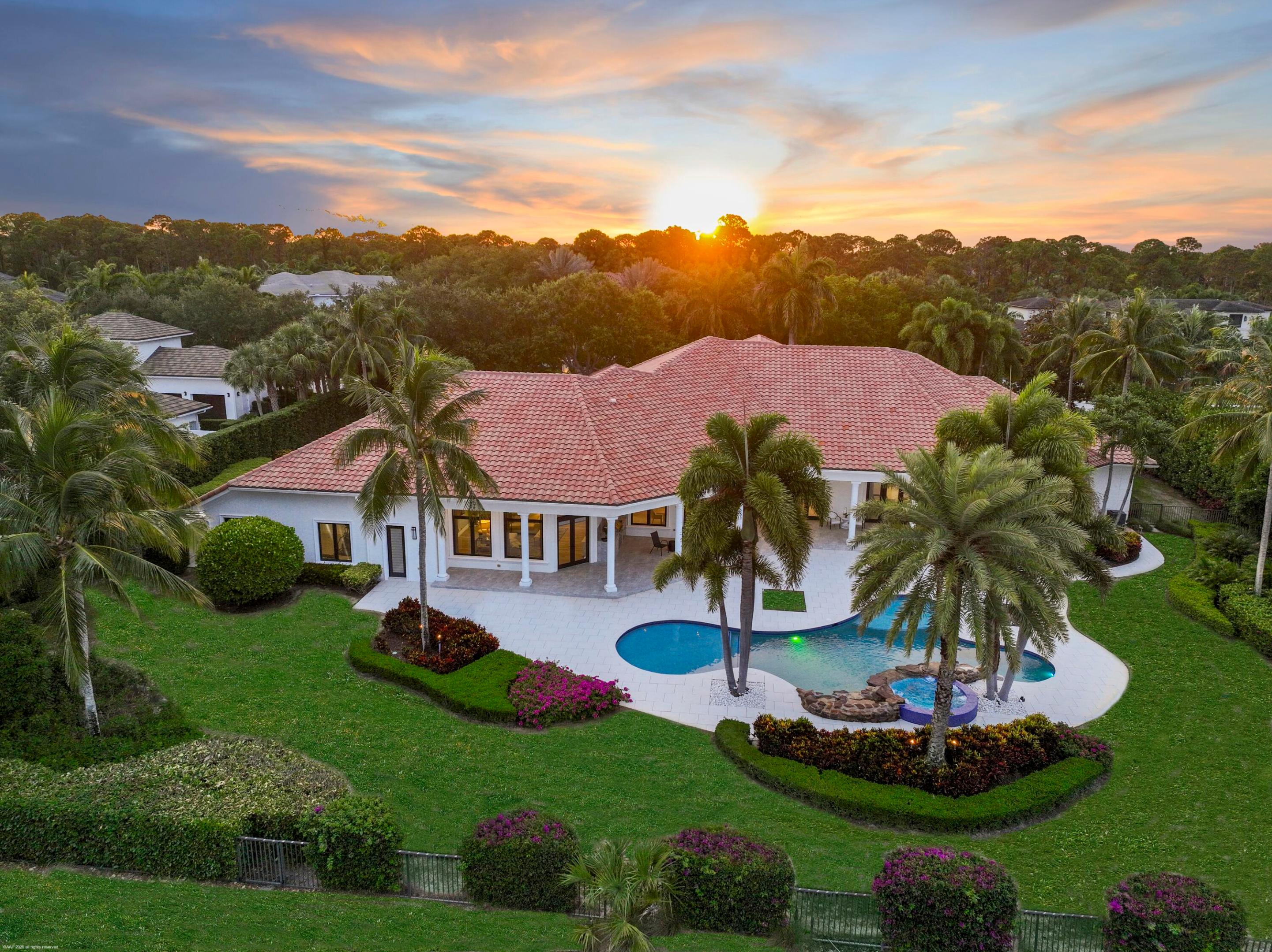 Experience the pinnacle of luxury living in this magnificent estate home nestled within one of Palm Beach Gardens' most exclusive golf communities- Old Palm Golf Club. Perfectly positioned on a premium lot overlooking the manicured fairways, this grand residence offers sweeping golf course views, refined architectural details, and resort-style amenities.

Boasting over 8,200 square feet of elegant living space, this home features 5 spacious bedrooms, 8 spa-inspired bathrooms, and a gourmet chef's kitchen with top-of-the-line appliances, custom cabinetry, and an oversized island ideal for entertaining. Soaring ceilings, designer finishes, and expansive windows flood the home with natural light and enhance its open, airy ambiance. The luxurious primary suite is a true retreat, offering panoramic golf course views, a private sitting area, custom walk-in closets, and 2 spa-style ensuite bathrooms. Outdoors, enjoy Florida living at its finest with a sprawling lanai, summer kitchen, and a custom pool with a sun shelf, all framed by lush tropical landscaping and unobstructed views of the course.

Residents of Old Palm enjoy access to world-class amenities including championship golf, a state-of-the-art fitness center, fine and casual dining, as well as a vibrant social calendar. Just minutes from upscale shopping, fine dining, and pristine beaches, this estate presents a rare opportunity to live in luxury and style.
Schedule your private showing today and experience Palm Beach Gardens' most exclusive address.
