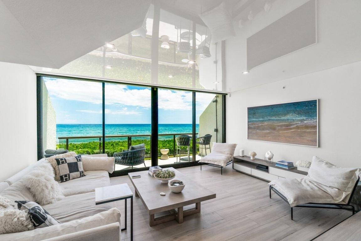 Beyond exquisite and calling those who appreciate only the finest. This exclusive and rare direct oceanfront designer renovated townhome is the definition of coastal luxury. Airy, light and bright, this 3 bedroom/2.5 bath, 3 level home underwent a total renovation, completed in 2022, with no detail overlooked and only the finest materials and craftsmanship used. Every aspect has been luxuriously touched with a designer's eye and updated to state-of-the-art. Feeling like a new construction single family home and coupled with with benefit of condo amenities, you have access to the Ocean Terrace fitness club, refurbished pool and pool deck, club room and private beach access directly out you back door. Situated directly on the sand, with beach access directly out your backdoor via your private oceanfront patio, you will enjoy spectacular, panoramic ocean views from all three floors with an abundance of natural light and great energy. 

Features Include:

- Custom kitchen European-Style flat front cabinets with extension bar and Pompeii Greylac Quartz on kitchen island and backsplash
- High-end luxury Jennair Noir appliances (fully integrated French Door refrigerator with obsidian interior, induction cooktop, microwave oven with speed-cook, wall oven with vertical dual-fan convection system, dishwasher)
- Side-by-side Zephyr wine cooler and beverage cooler in bar area
- Newer Rheem hot water heater
- Newer commercial grade A/C system with anti-microbial super duct and contemporary linear vents installed throughout
- Porcelain wood-plank tile throughout
- Custom glass railings
- Porcelain tile bathrooms with custom glass enclosures, body sprayers, and rain systems
- Contemporary Primary Bathroom with open concept, bidet, and free standing tub with ocean views
- Primary Bedroom includes custom built TV wall unit with European-Style flat front cabinets and Zephyr beverage bar refrigerator
- Custom veneered floating vanities in all bathrooms with apron Pompeii Quartz countertops
- High reflective white Eco Ceilings on all 3 levels for vapor & sound barrier and ocean reflections
- Custom library nook under stairs
- Custom veneered closet systems in all bedroom closets and ample linen storage
- 2nd floor newer LG Washer/Dryer
- 3-panel solid contemporary style interior doors throughout
- 4" rectified door casings and 6" rectified baseboards throughout
- Newer fire sprinkler system throughout
- Impact windows and doors throughout
- Ground level patio with beach access and oversized balcony off of the Primary Suite providing amazing outdoor living and entertaining options

Ocean Terrace North is one of the few pet-friendly coastal buildings in the area, offering a rare opportunity to enjoy seaside living without compromise. This residence includes one assigned parking space and is ideally situated in Highland Beach directly between Delray Beach and Boca Raton, providing effortless access to premier shopping, acclaimed restaurants, outdoor recreation, and convenient interstate access.