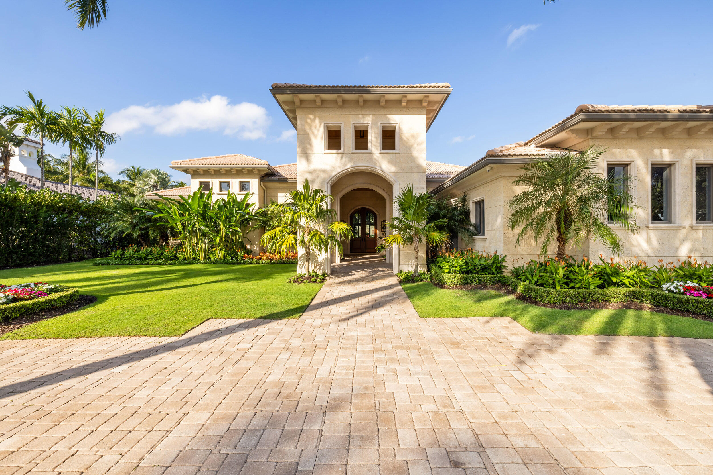 This fully reimagined 4-bedroom, 4.2-bath estate offers modern Palm Beach luxury in the exclusive gated community of Old Palm. Completely transformed, the home features new landscaping, manicured hedging for privacy, a resort-style screened outdoor lounge and dining area, and a heated pool with shaded pet-run.

Inside, natural light, French oak floors, custom millwork, and clean architectural lines create an elegant, inviting atmosphere. The chef's kitchen includes Wolf, Sub-Zero, and Bosch appliances, bespoke cabinetry, hidden pantry, and dedicated water filtration, with a nearby bar and media room for entertaining.

All bathrooms feature new stone surfaces, refined fixtures, and spa-like finishes. The private primary suite offers custom closets and a calming retreat. Smart upgrades include added AC zones and an elevated, air-conditioned garage with new doors, flooring, and built-in storage.

Old Palm Golf Club provides a newly updated clubhouse, 20,000-sq-ft lifestyle center, spa, fitness facilities, and elite 33-acre practice facility. Membership purchase is required.